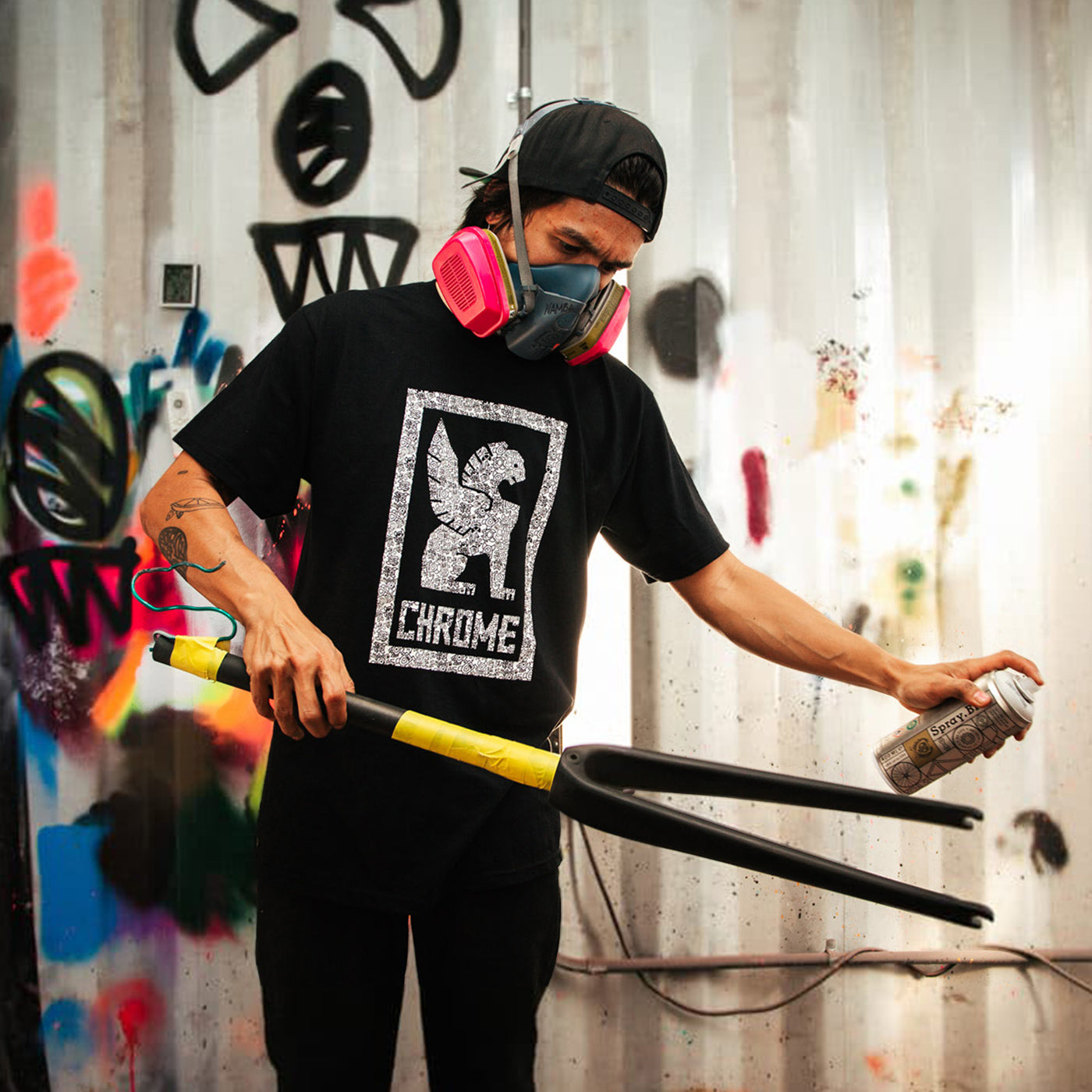 squid bikes staff creating art on a bike frame