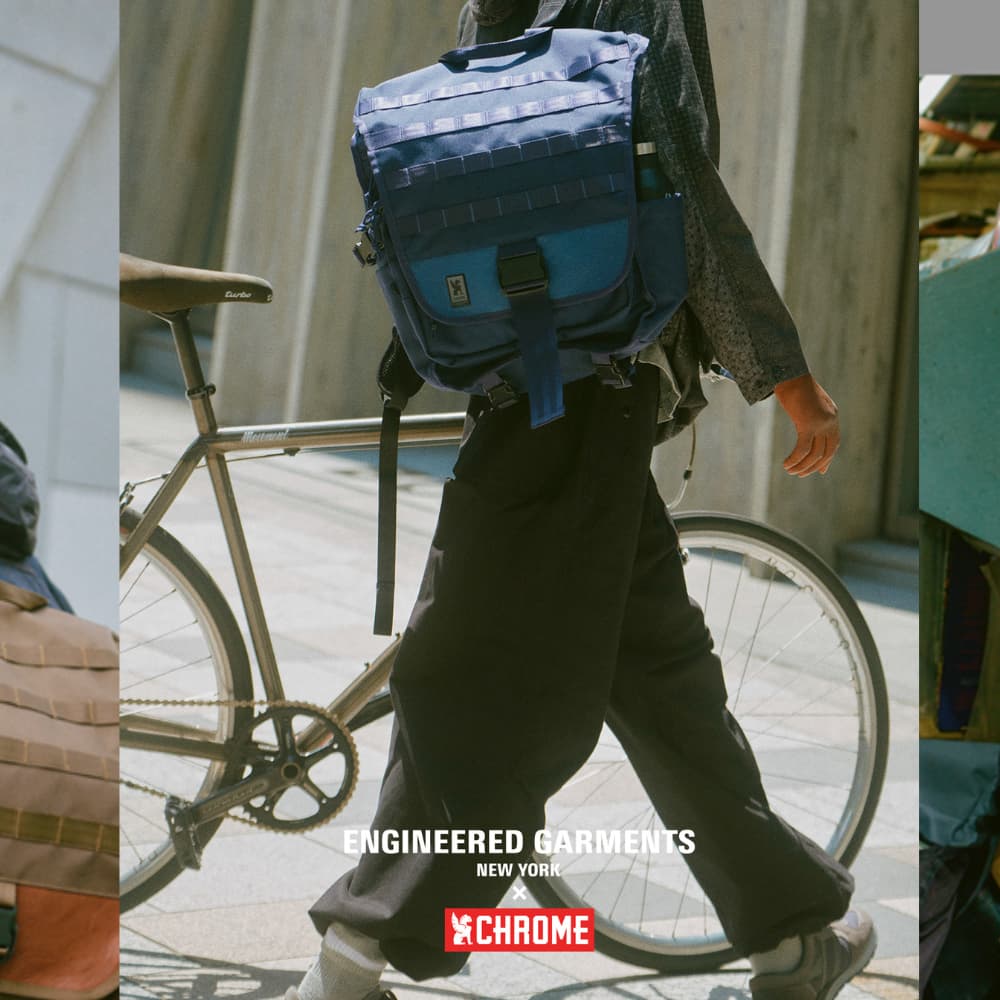 A person walking their bike wearing the Warsaw EG pack