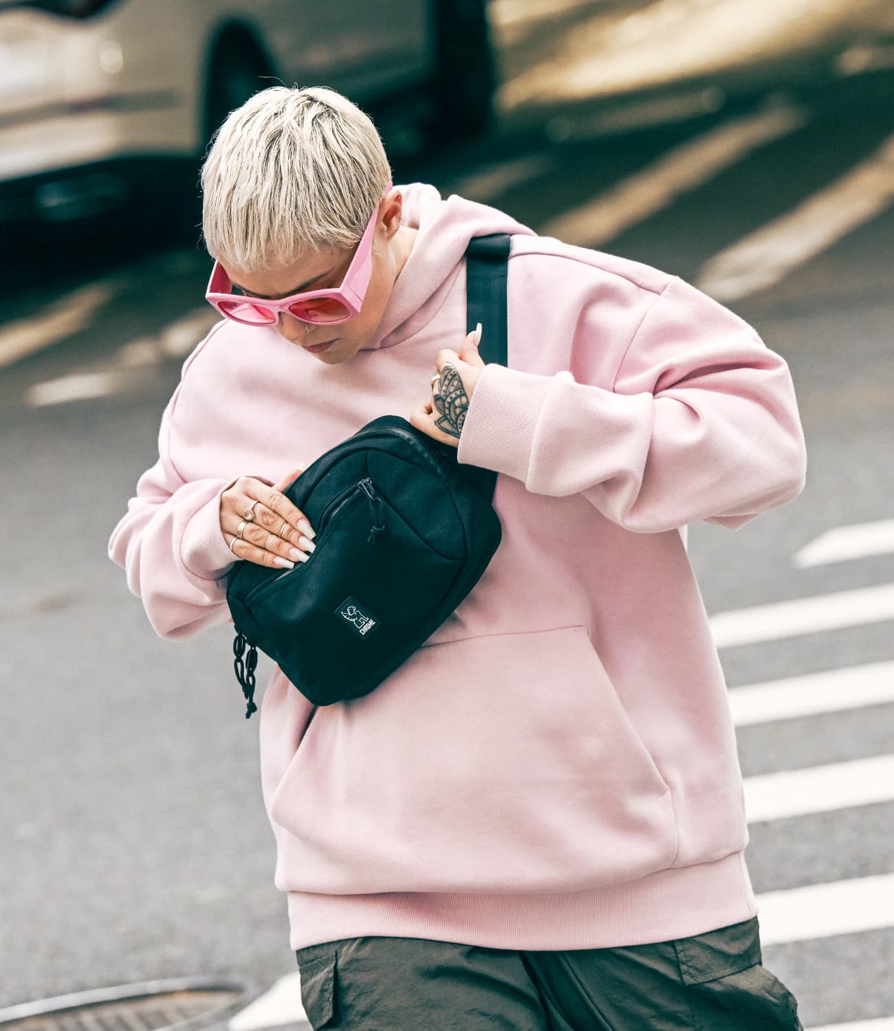 Person holding a Ziptop Waistpack smaller mobile size image