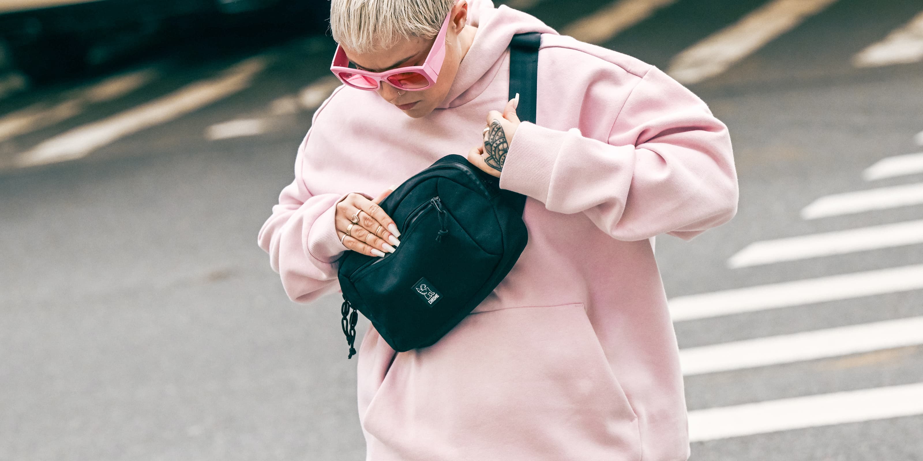 Person holding a Ziptop Waistpack larger desktop size image