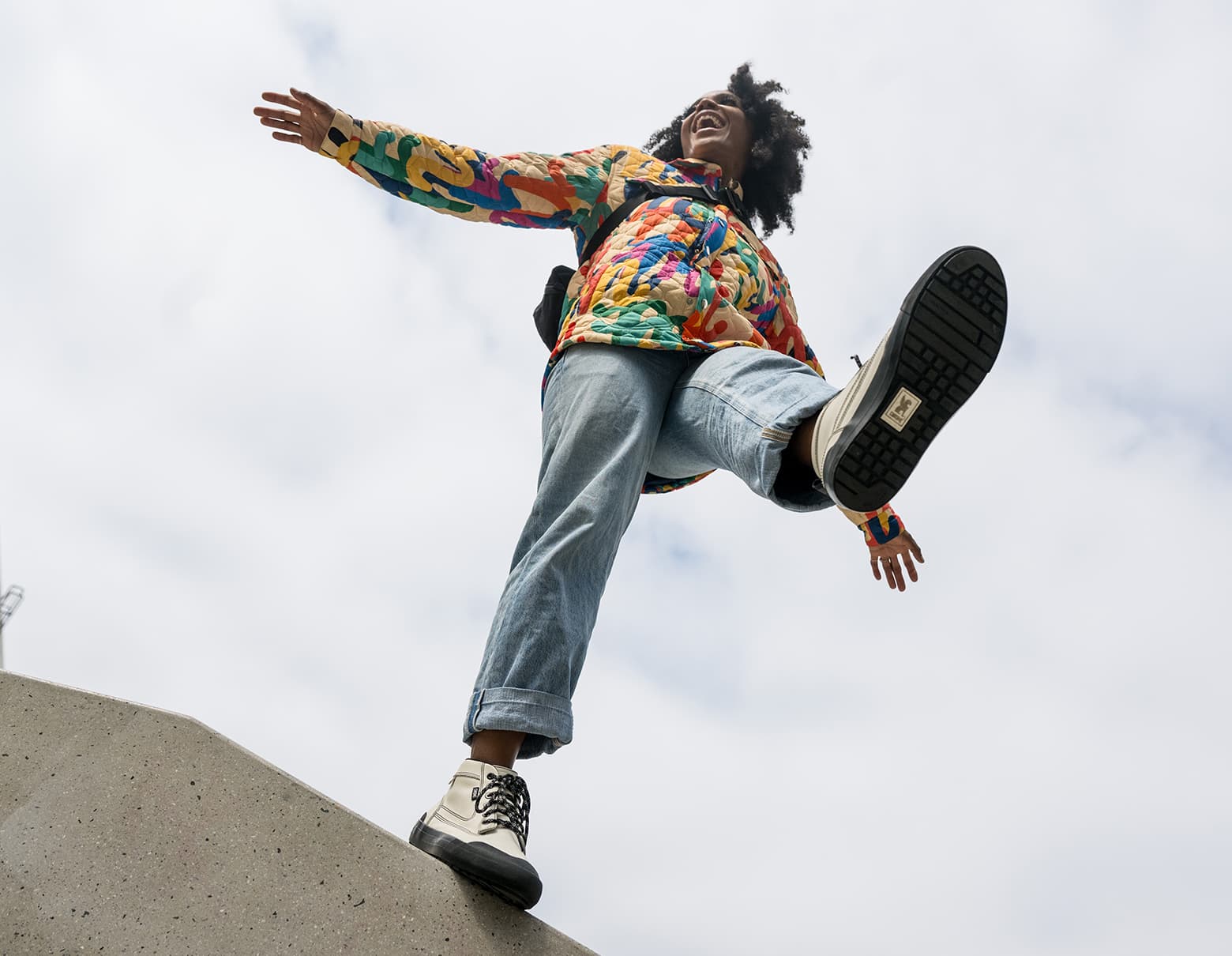 Woman wearing a colorful jacket and Storm 415 Boots