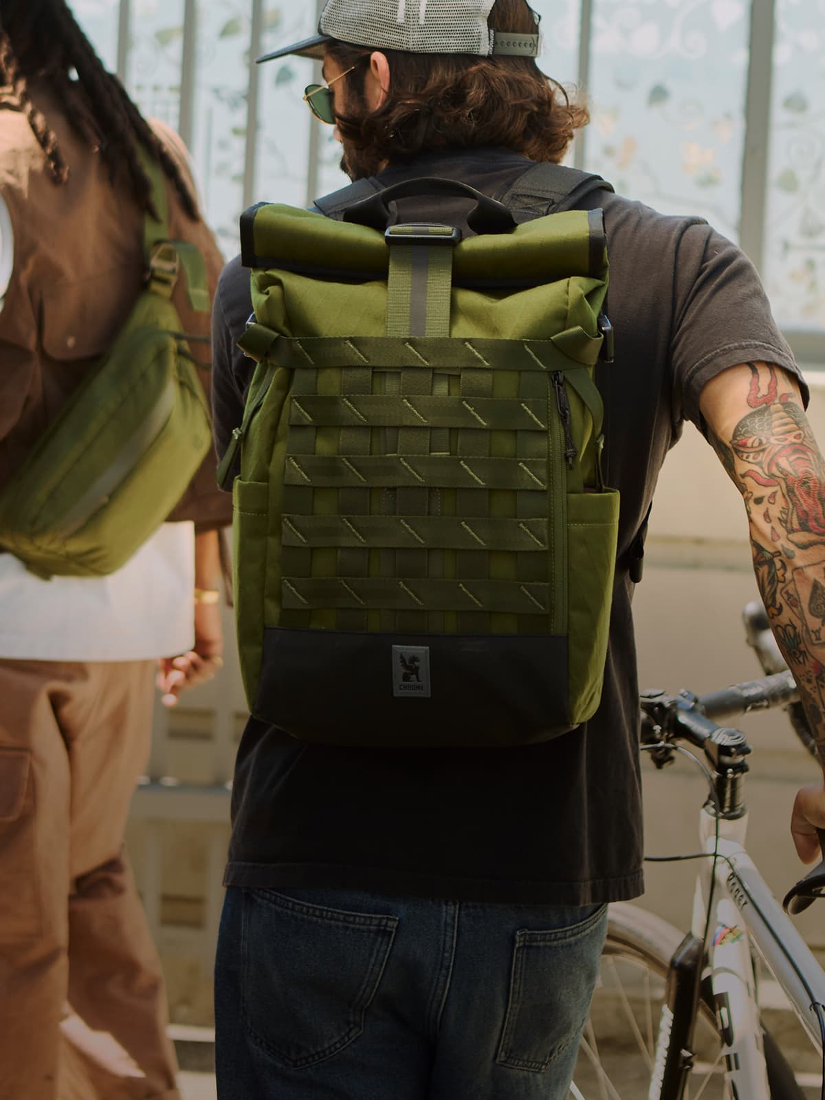 A guy wearing the Barrage 22L Backpack in Moss