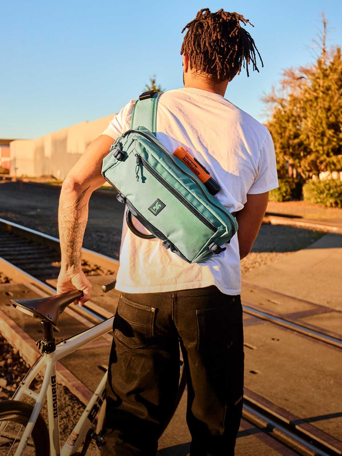 The Kadet 9L Sling on a guy walking his bike