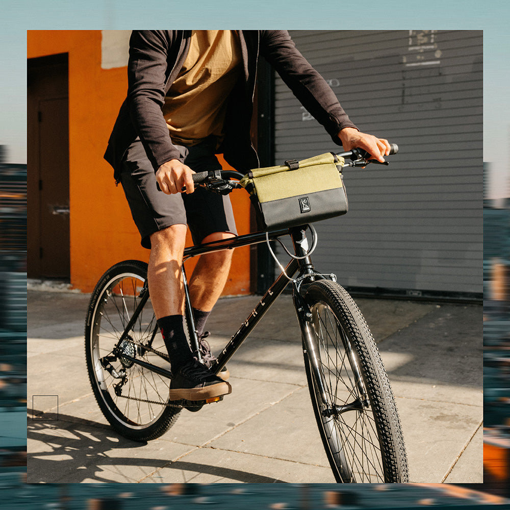 man on a bike in Chrome Industries shoes, shorts, jacket and bike bag