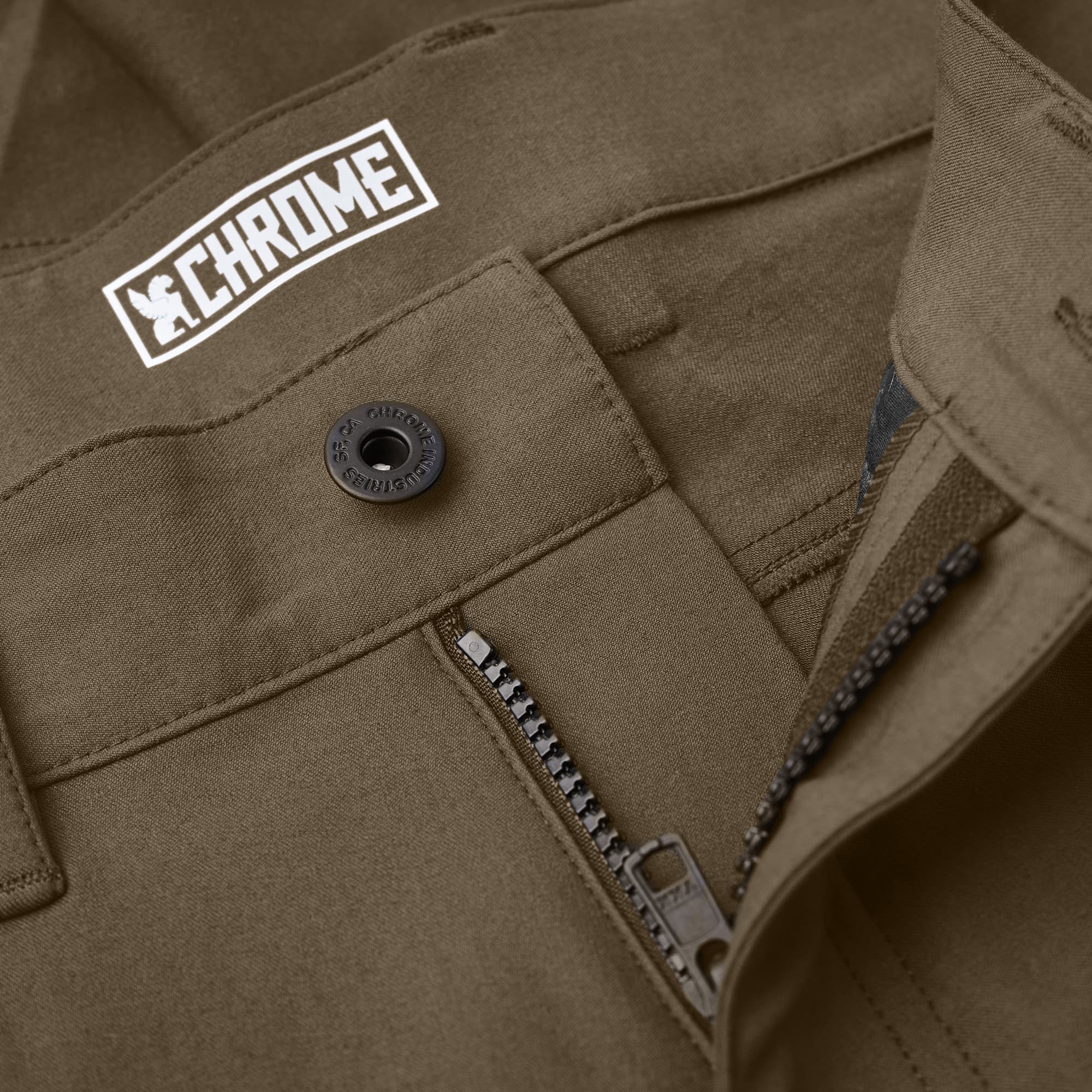 The zipper of the Madrona Men's shorts in brown #color_stone grey