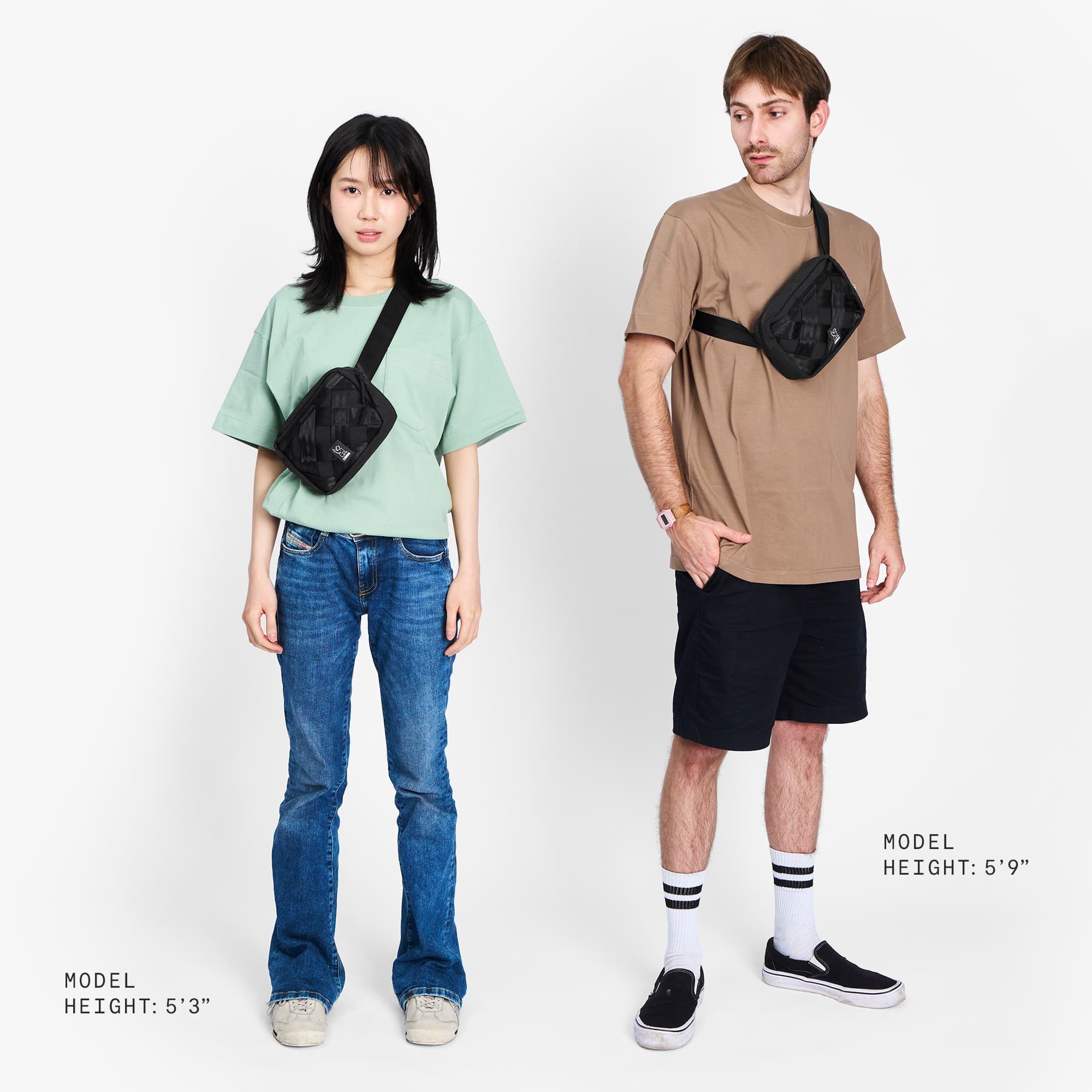 Two people wearing the Barrage 2L Sling