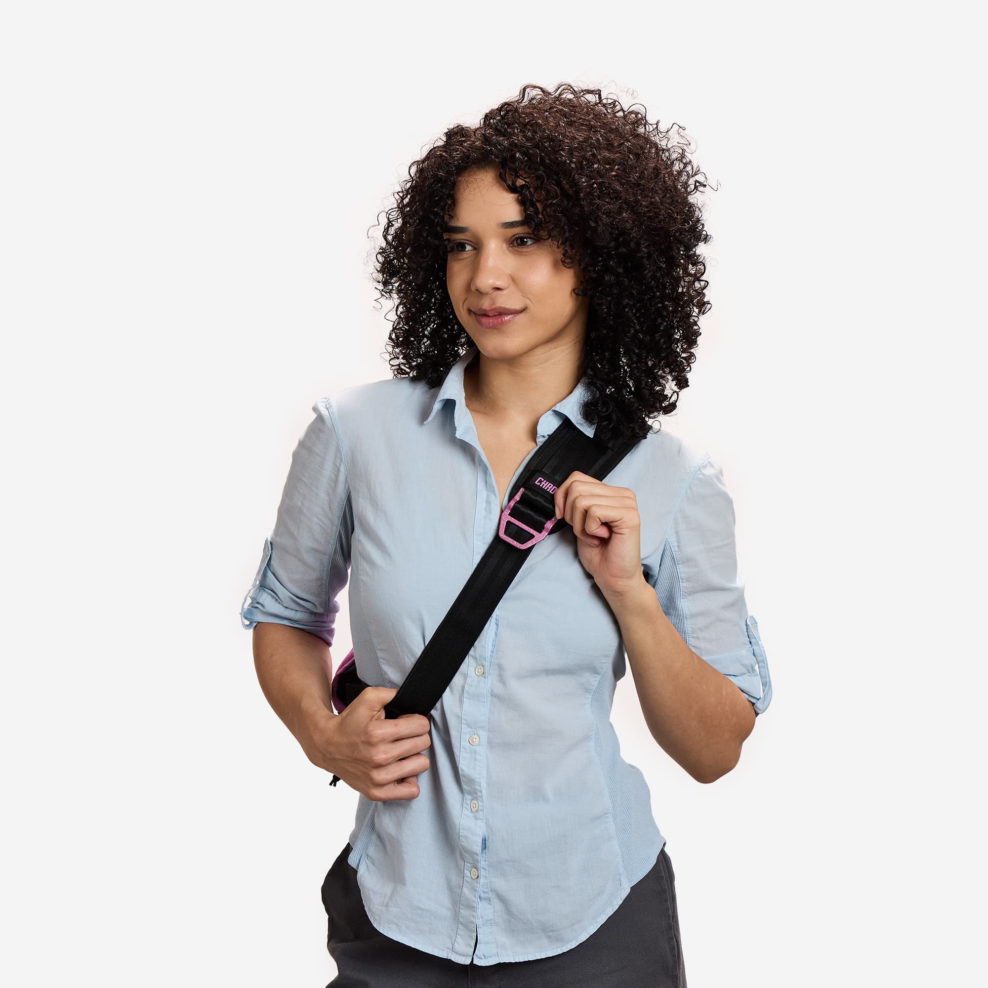 The front strap of the Pride Mini Kadet in Rio Rose Pink on a woman #color_rio rose pink