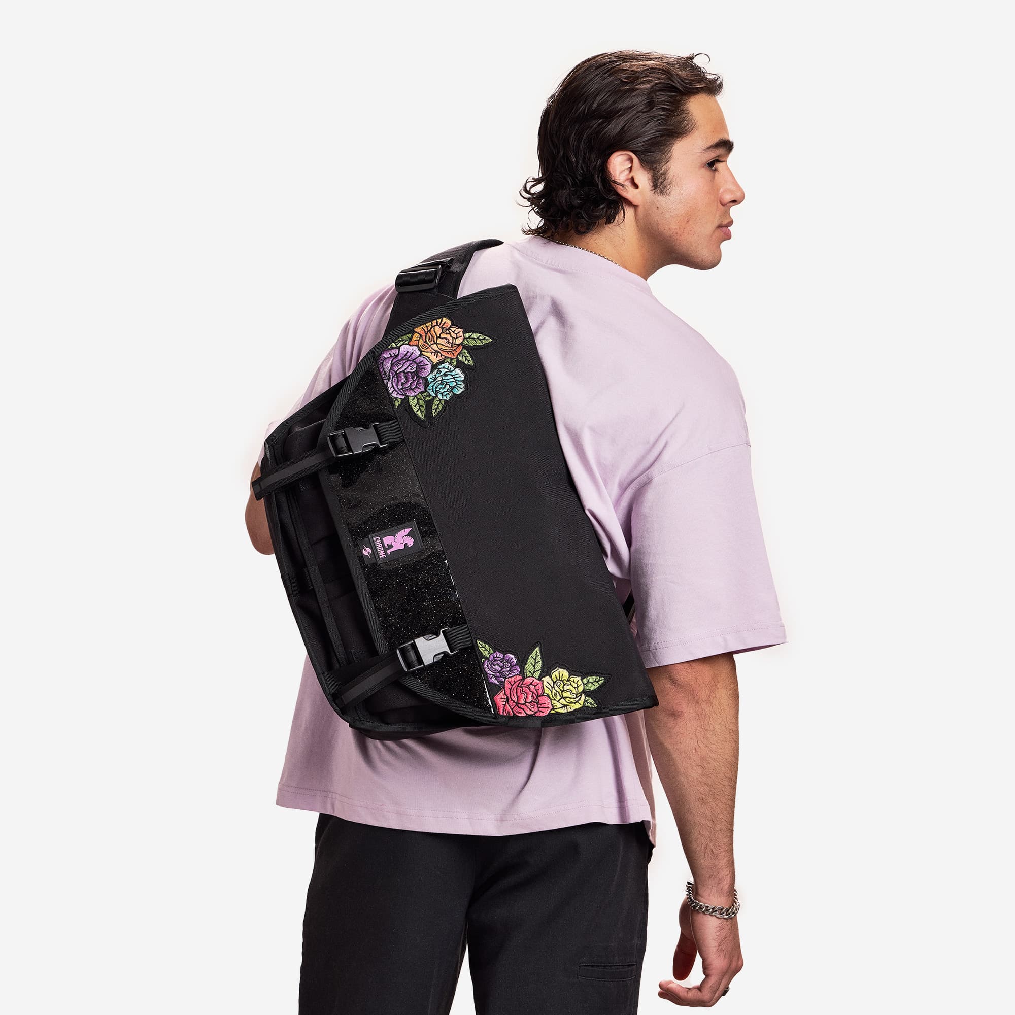 A man wearing the Chrome x Rio Pride Citizen 15L in Rio Black Rose #color_rio rose black
