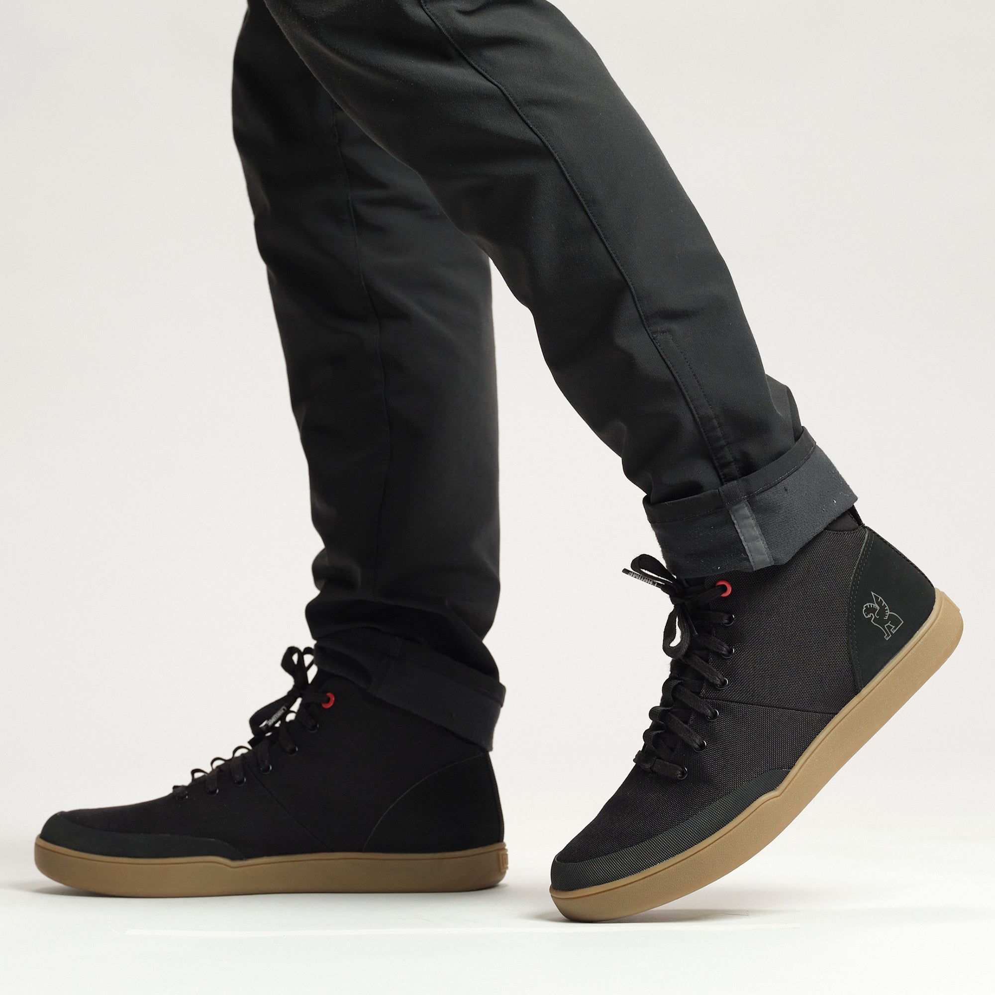 Bromley mid sneaker in black on a person #color_black gum