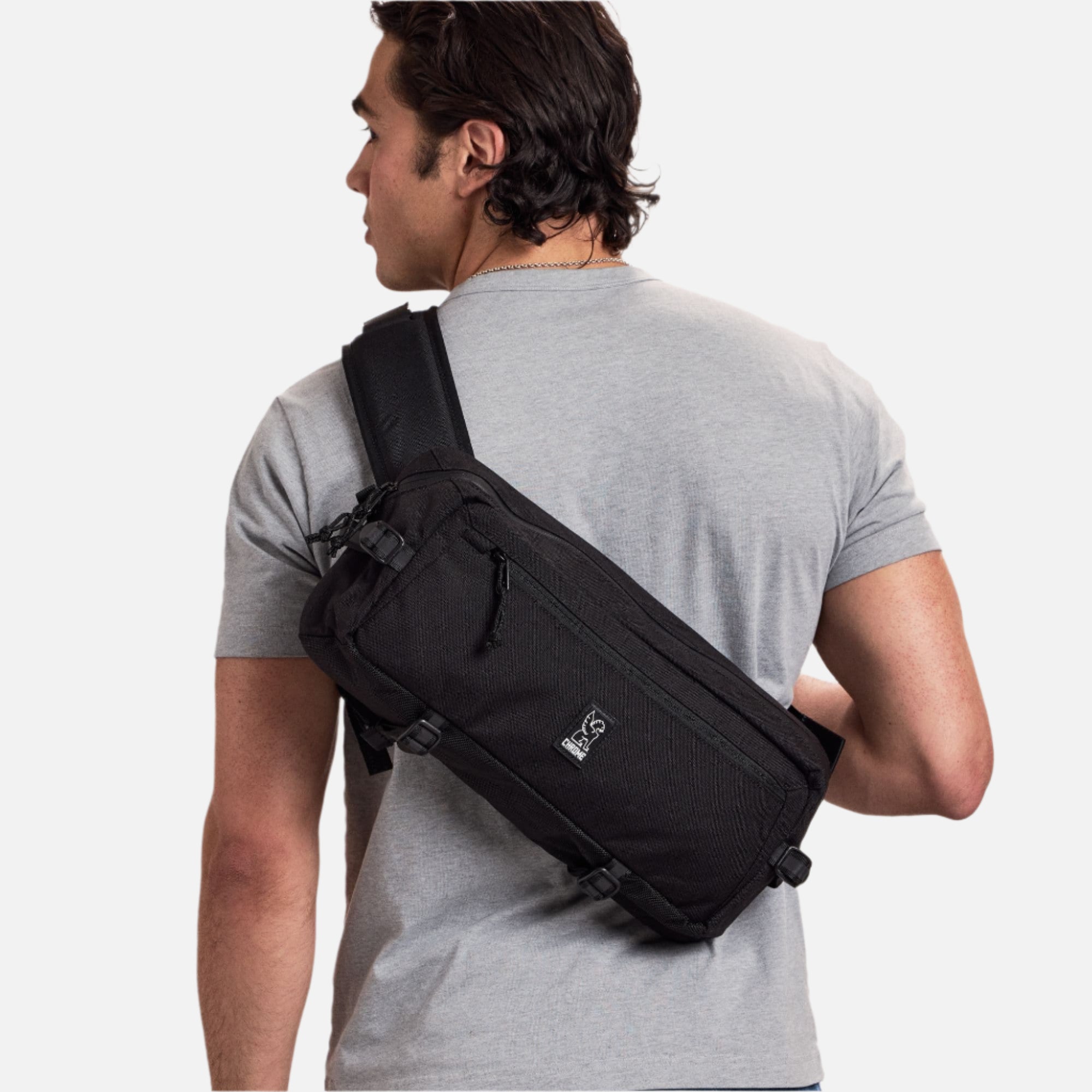 Man wearing the Kadet Slingfor the blue #color_indigo