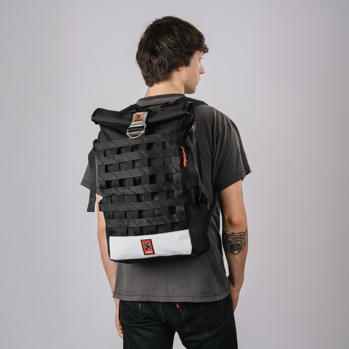The Barrage 22L in new Classic Black White back view on a guy #color_classic / black / white