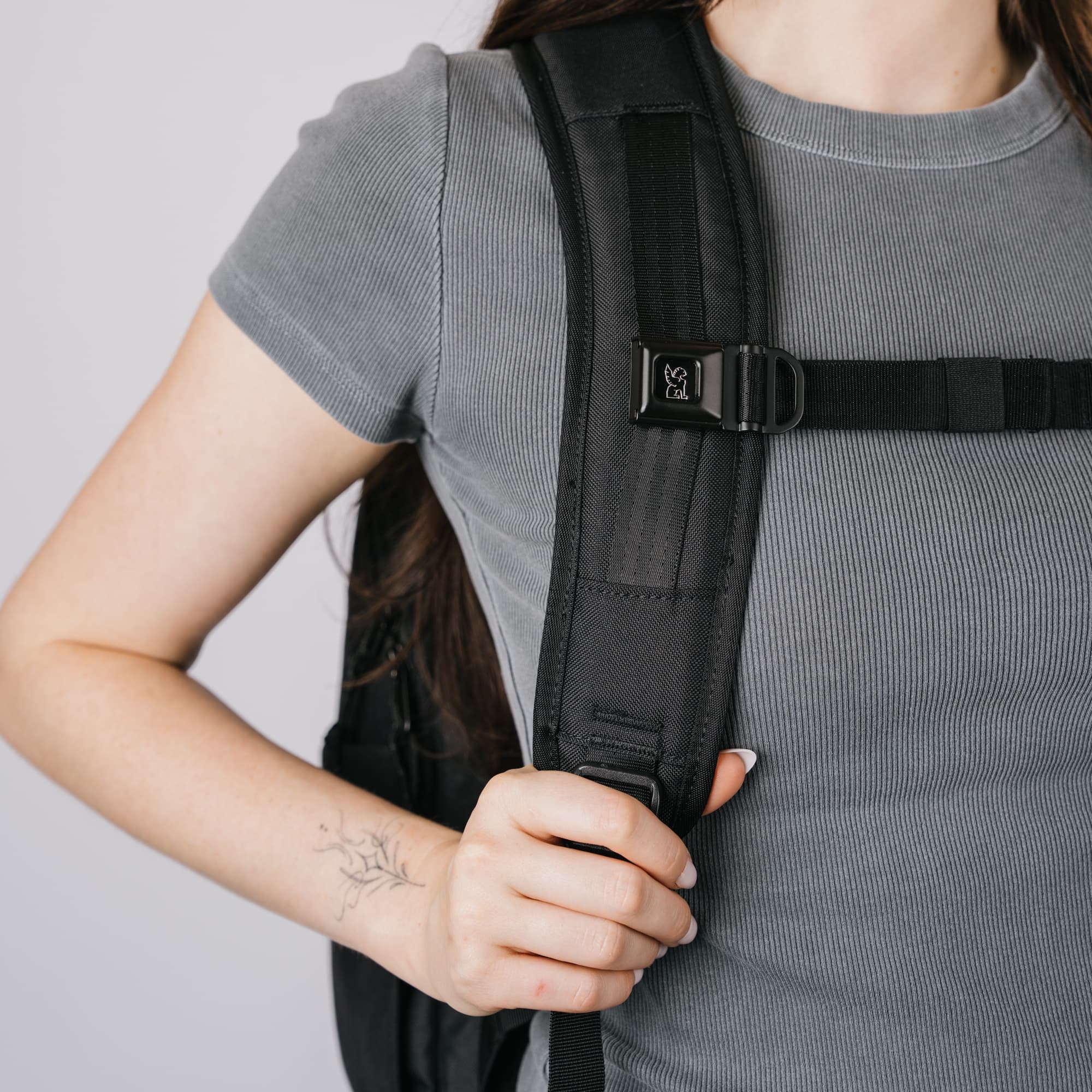 A zoomed in look at the iconic Mini Buckle Sternum strap on the Recruit 22L Backpack.