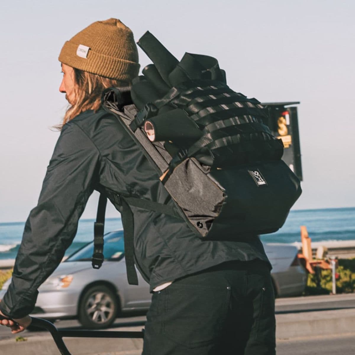 Person wearing a Barrage backpack with a scenic background