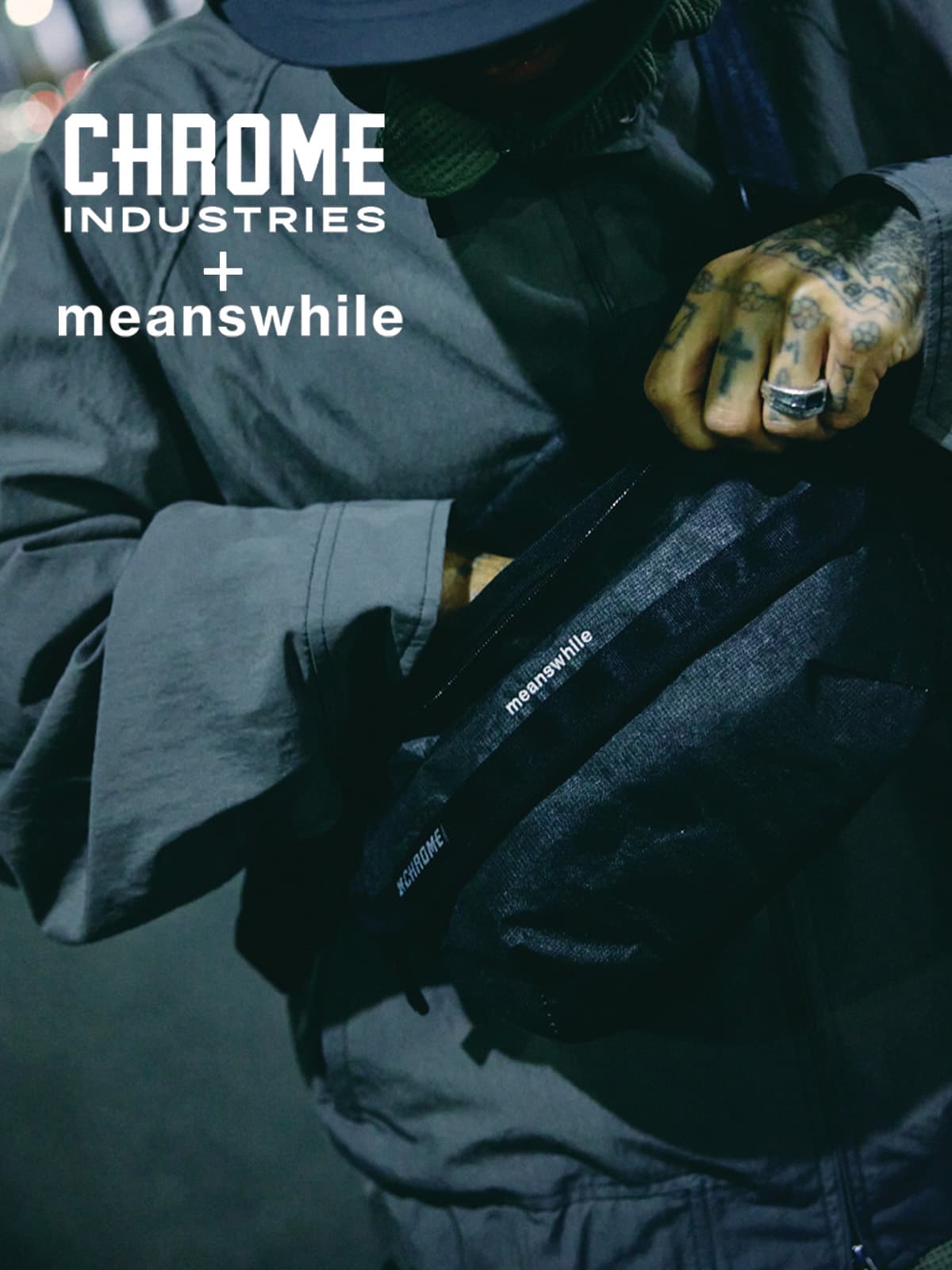Person holding a black bag with 'meanswhile' branding, featuring Chrome Industries logo.