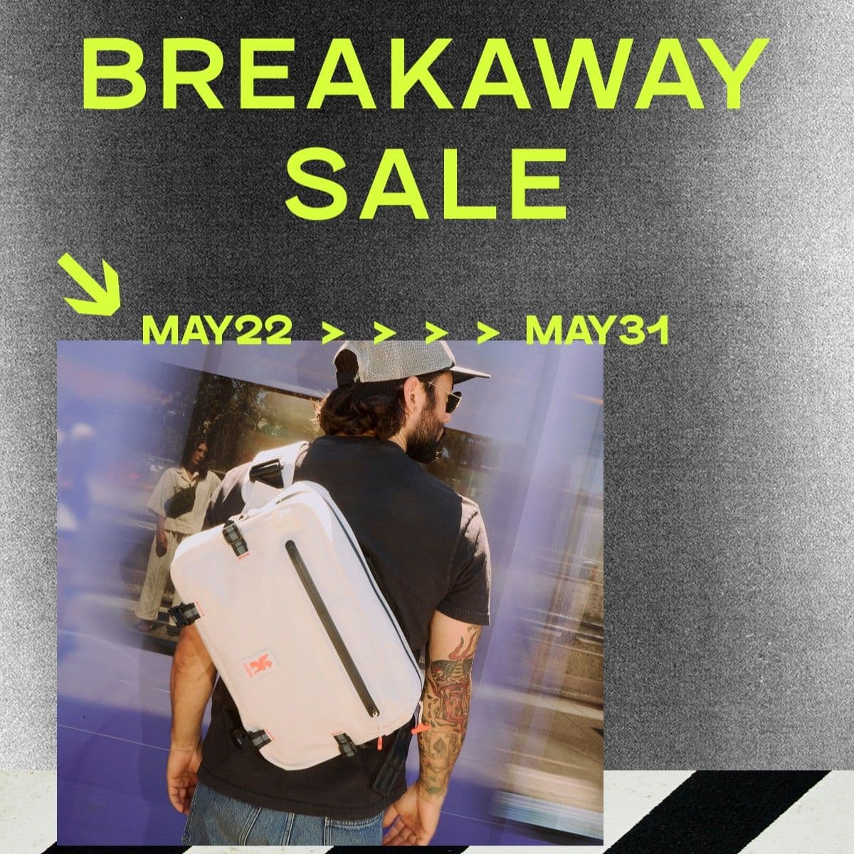 Person wearing the Kadet Max waterproof with 'Breakaway Sale' text and dates on a gray background