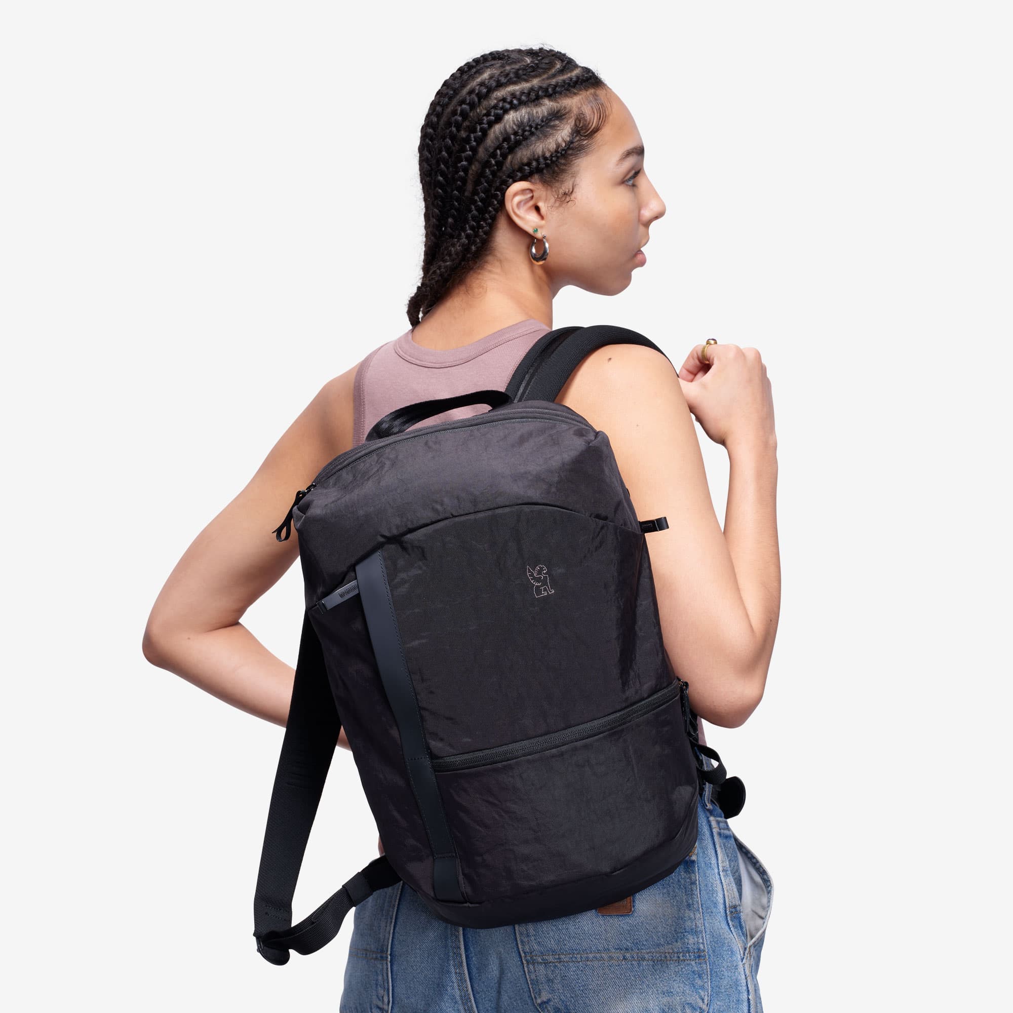 Camden backpack in black on a woman back view #color_black