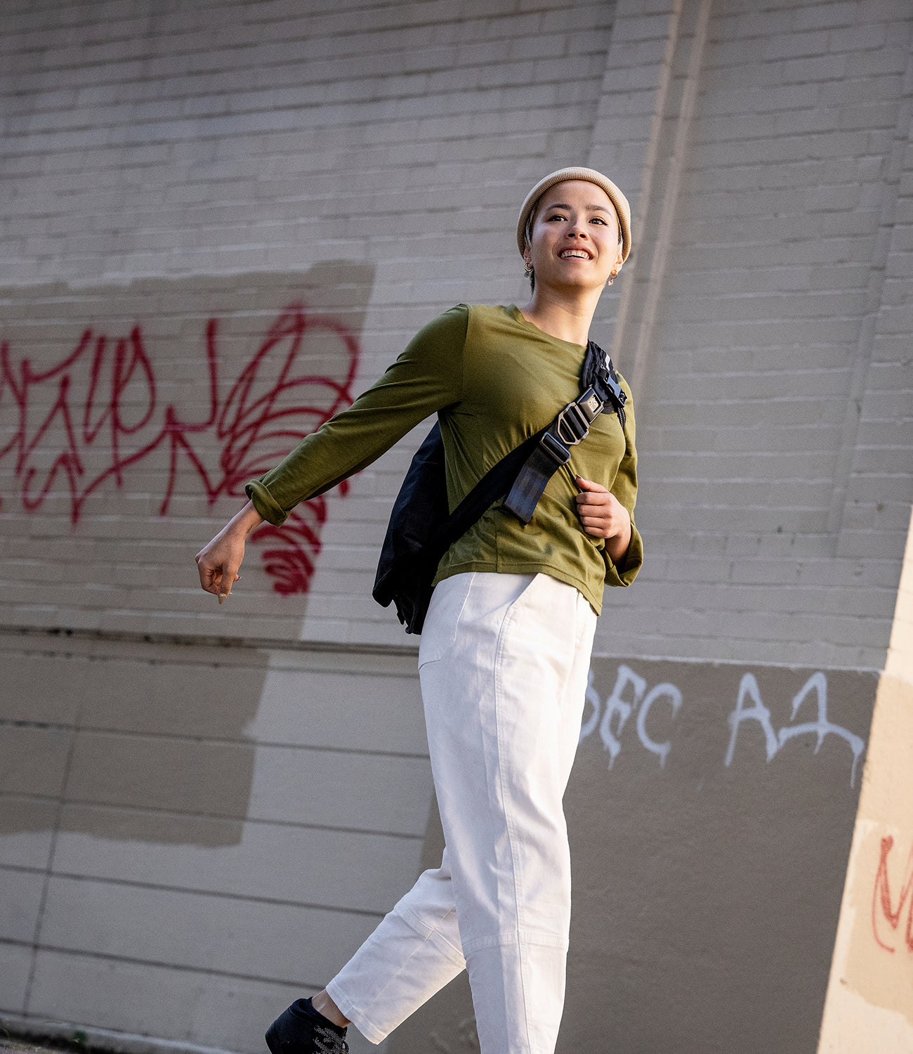 Women's Chrome Issued Long Sleeve Tee in green worn by a woman walking mobile size image