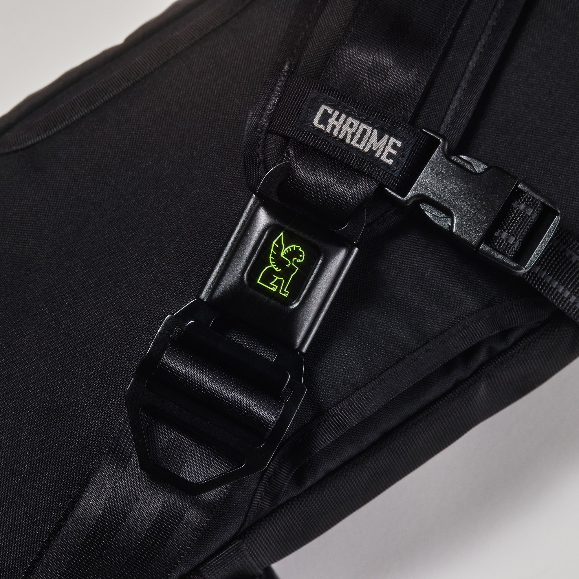 Chrome LG iconic buckle in green shown on a Kadet #color_green