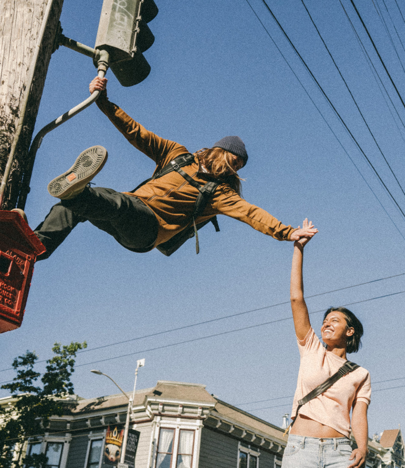 Men's Merino Cobra  worn by a guy climbing a light pole mobile size image