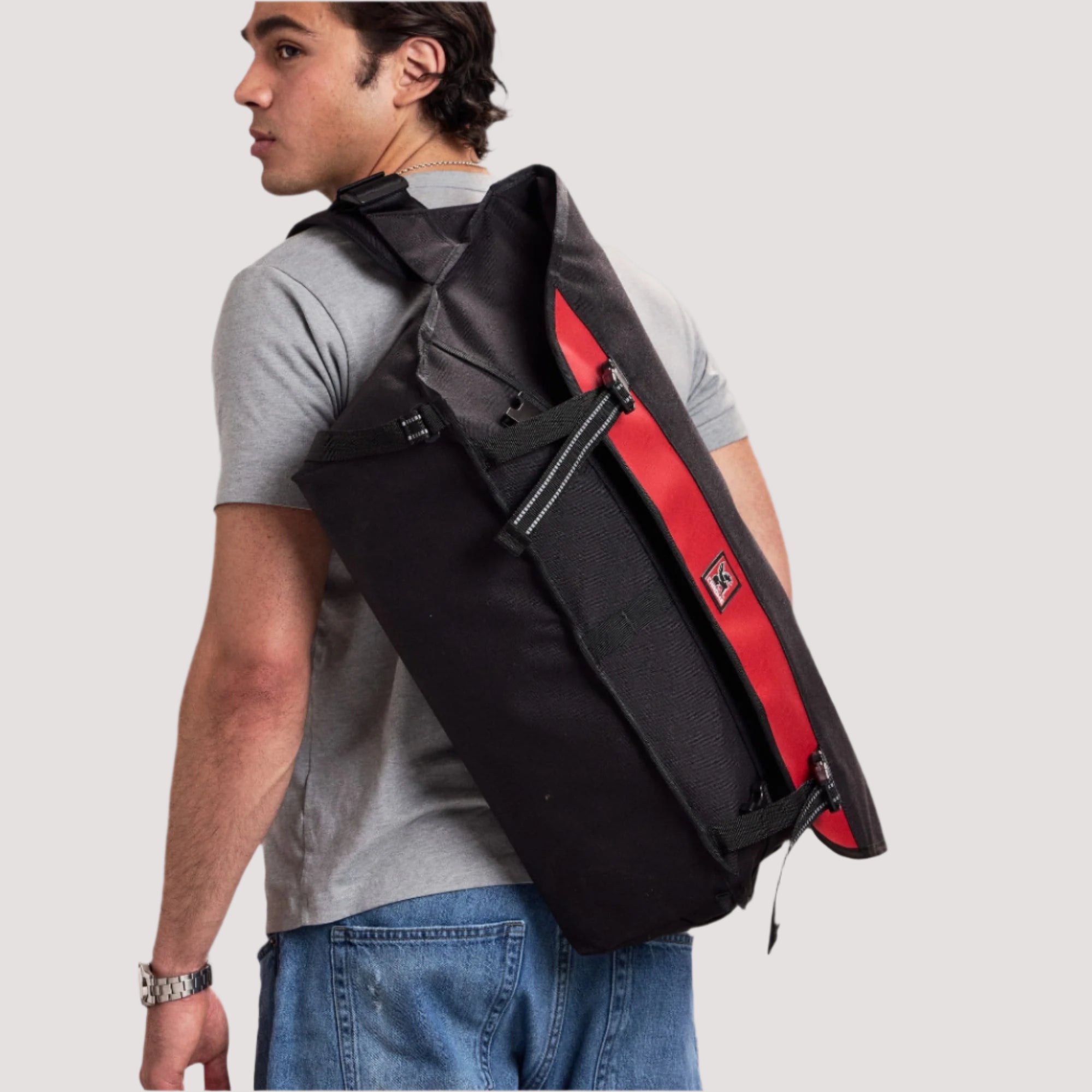 The Metropolis 40L Messenger on a guy's back in black