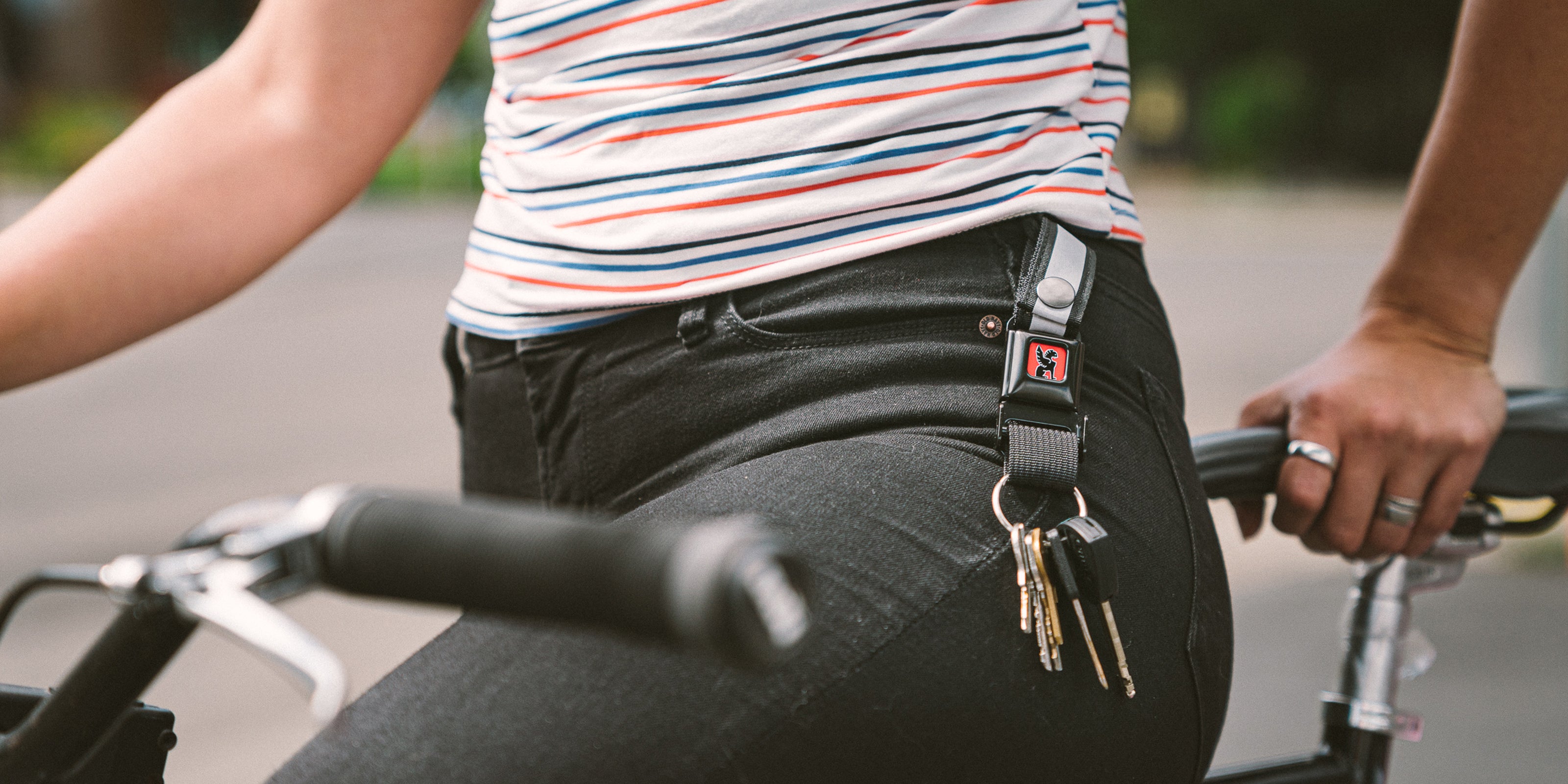 Mini Buckle Keychain worn by a woman on her belt loop desktop size image