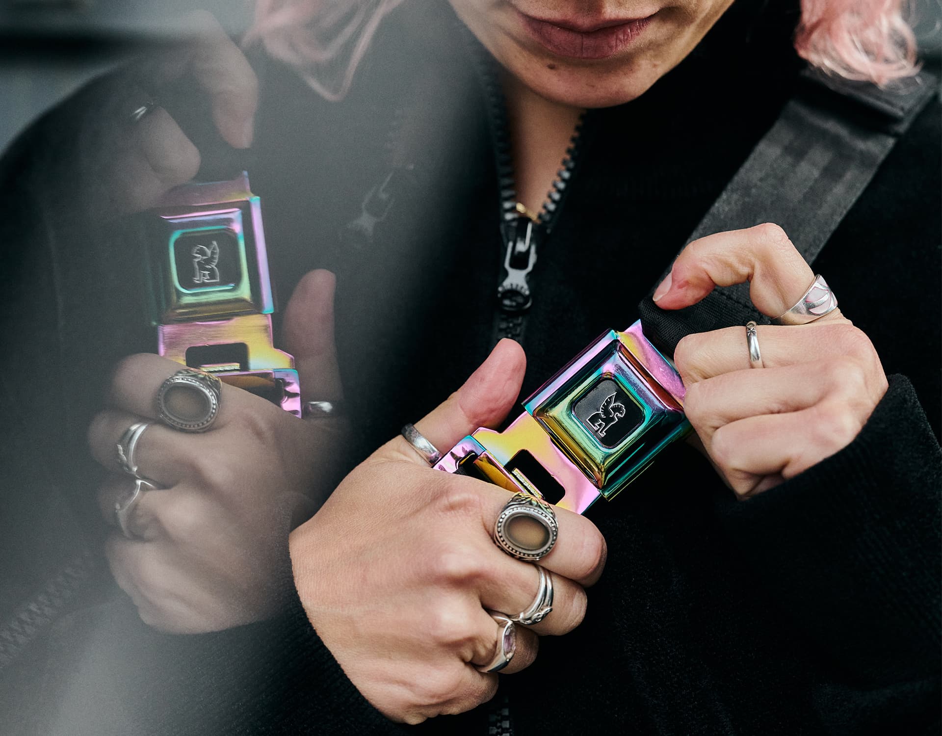 Girl closing an iconic Chrome buckle