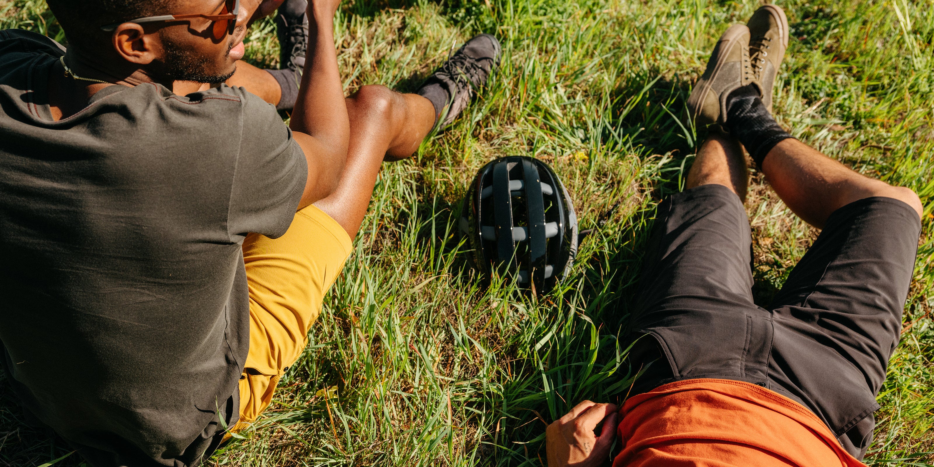 Men's Sutro Short worn by a guy laying in the grass desktop image size