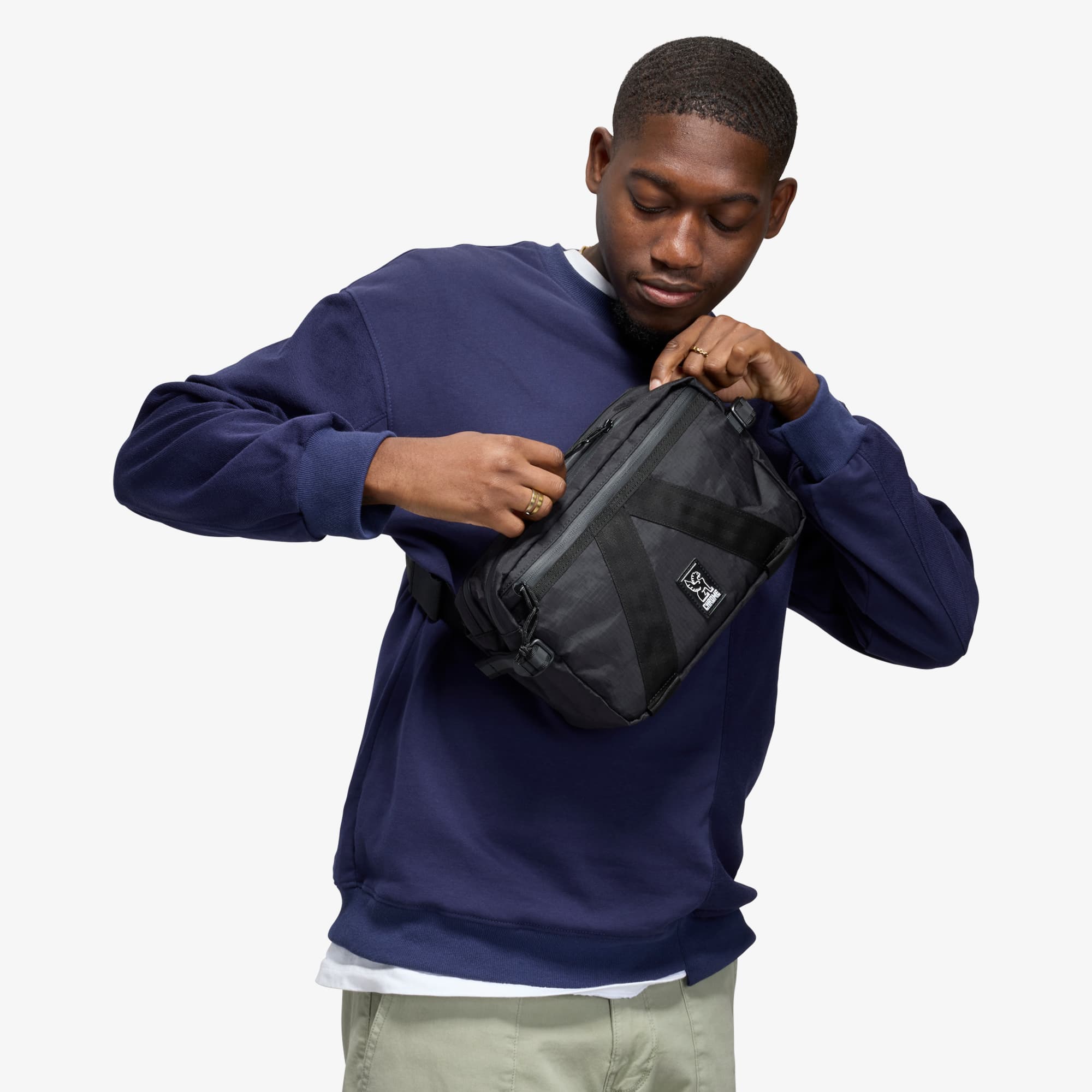 Tensile Sling in black operated by a man