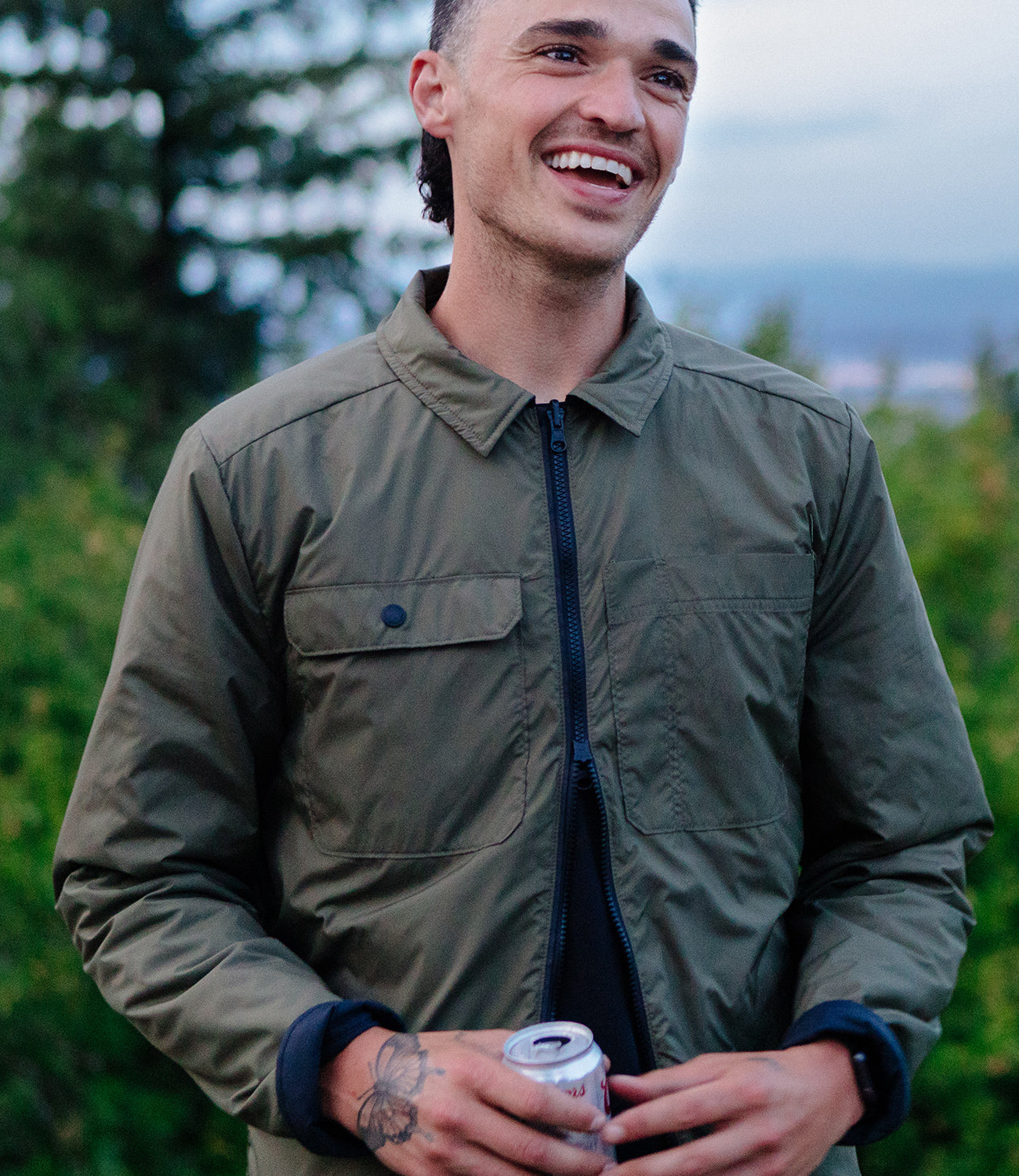 Reversible insulated jacket worn by a guy in the wild mobile size image