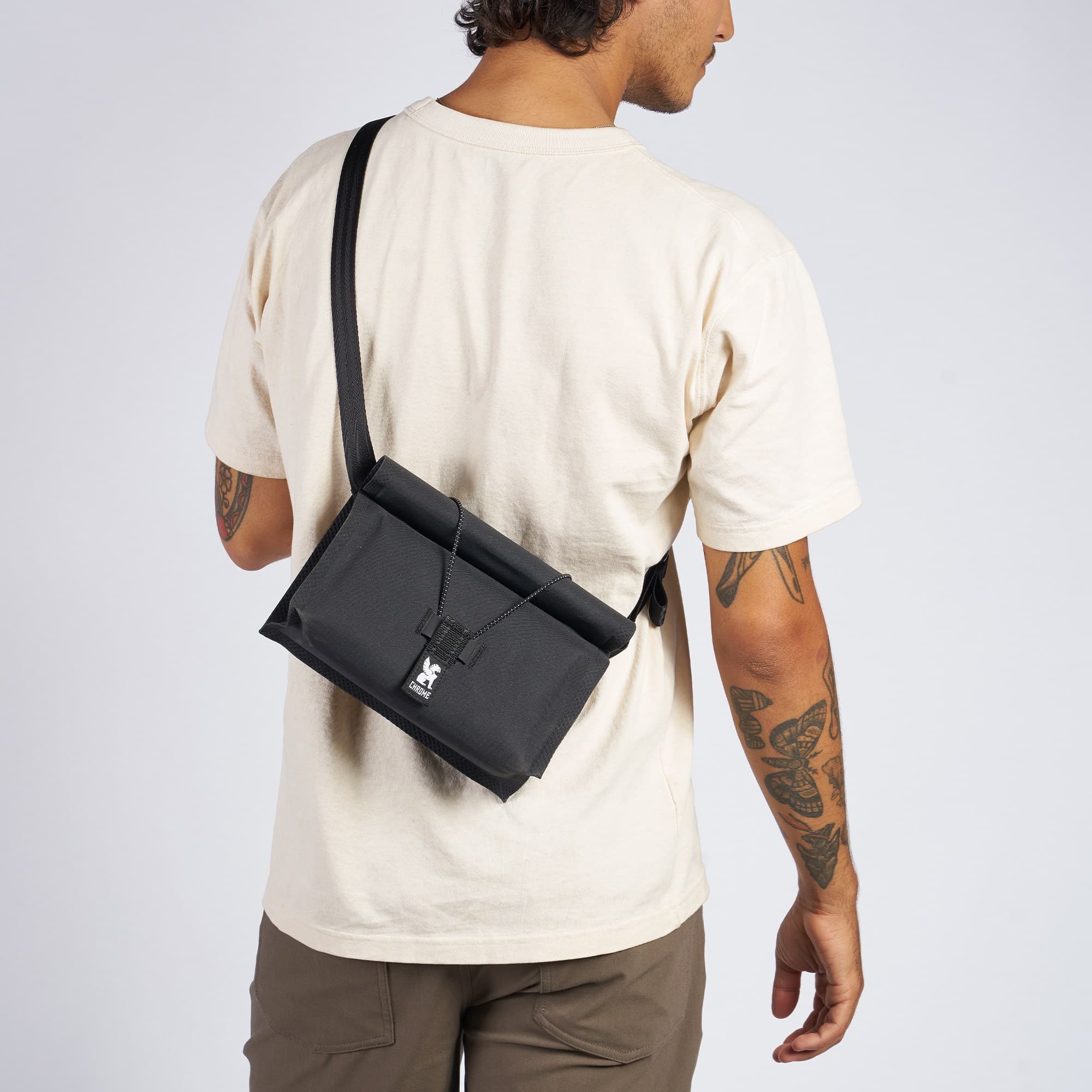 Urban Ex handlebar bag worn by a man as a sling