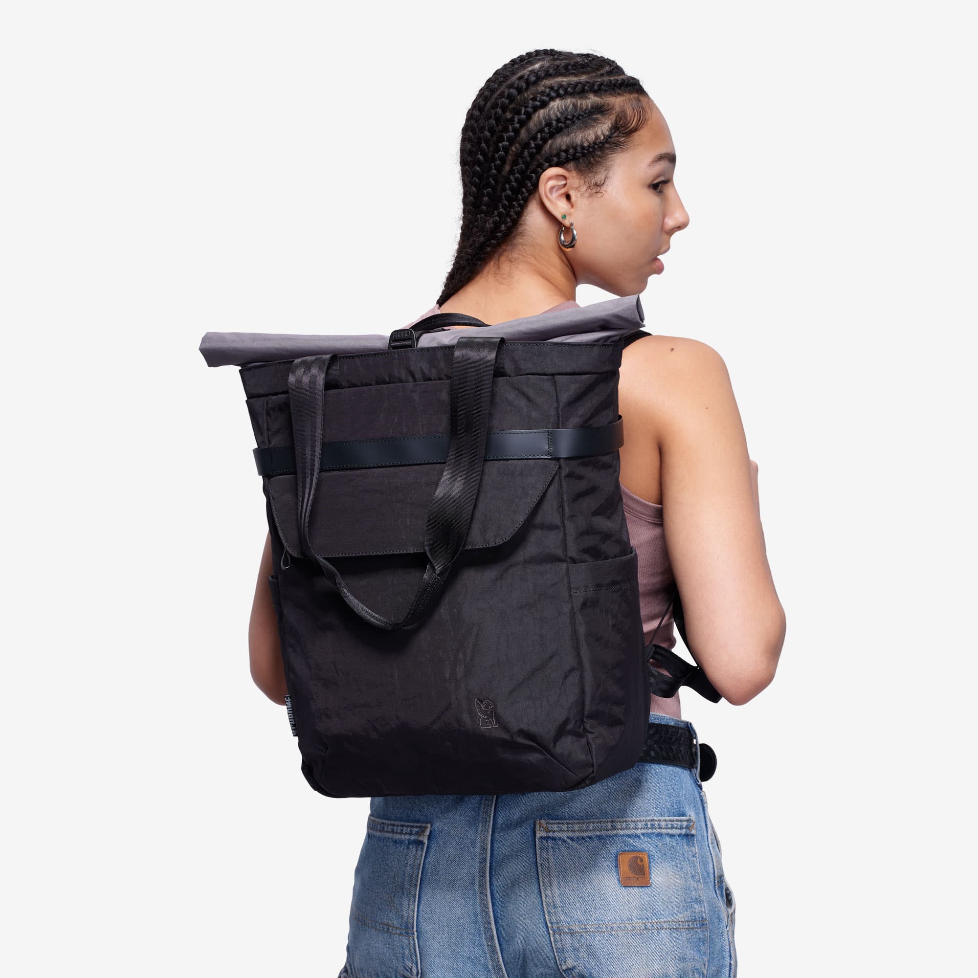 Valencia tote on a woman worn as a backpack