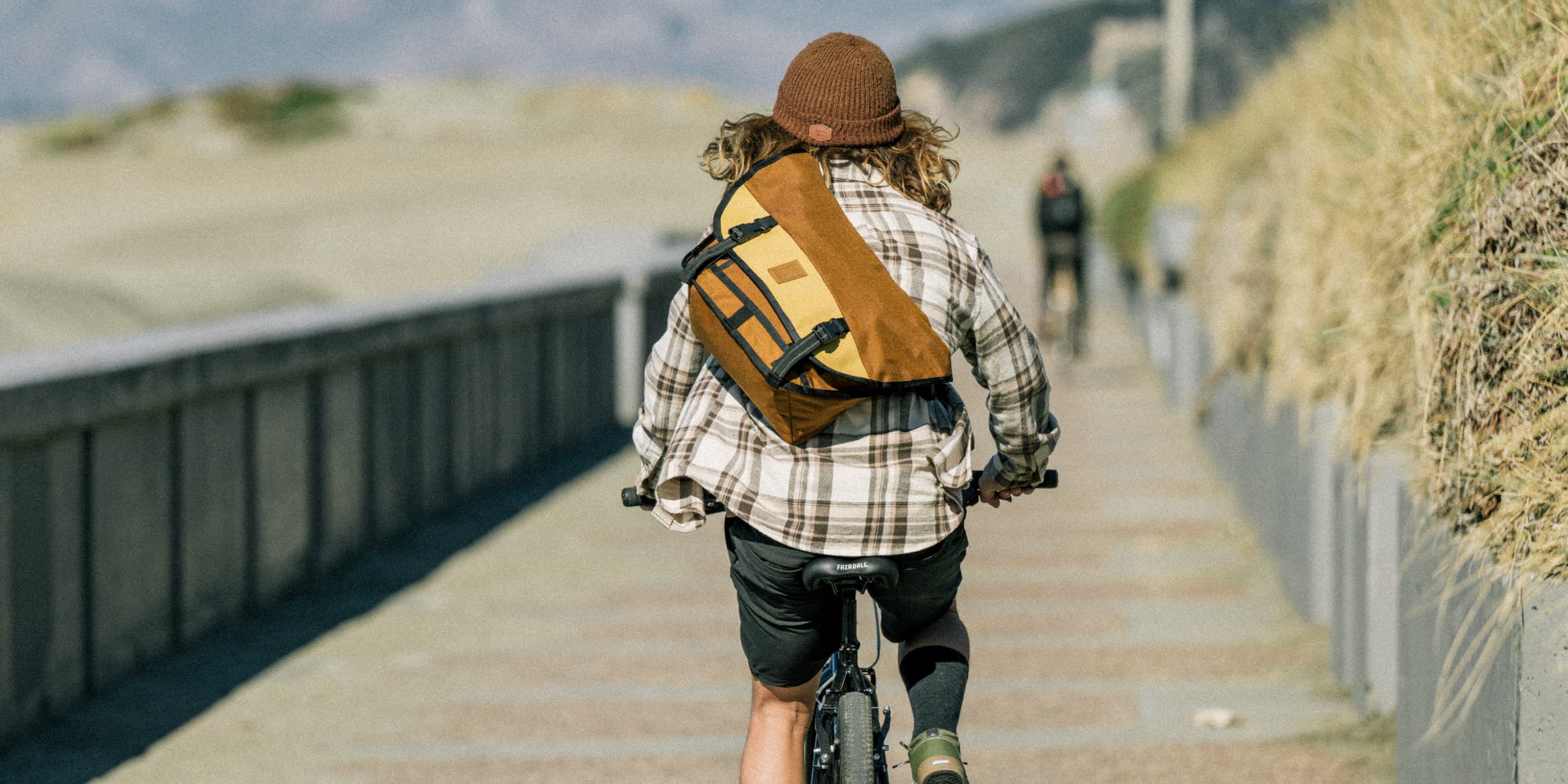 Citizen Messenger in Amber Tritone on a guy riding a bike desktop size image