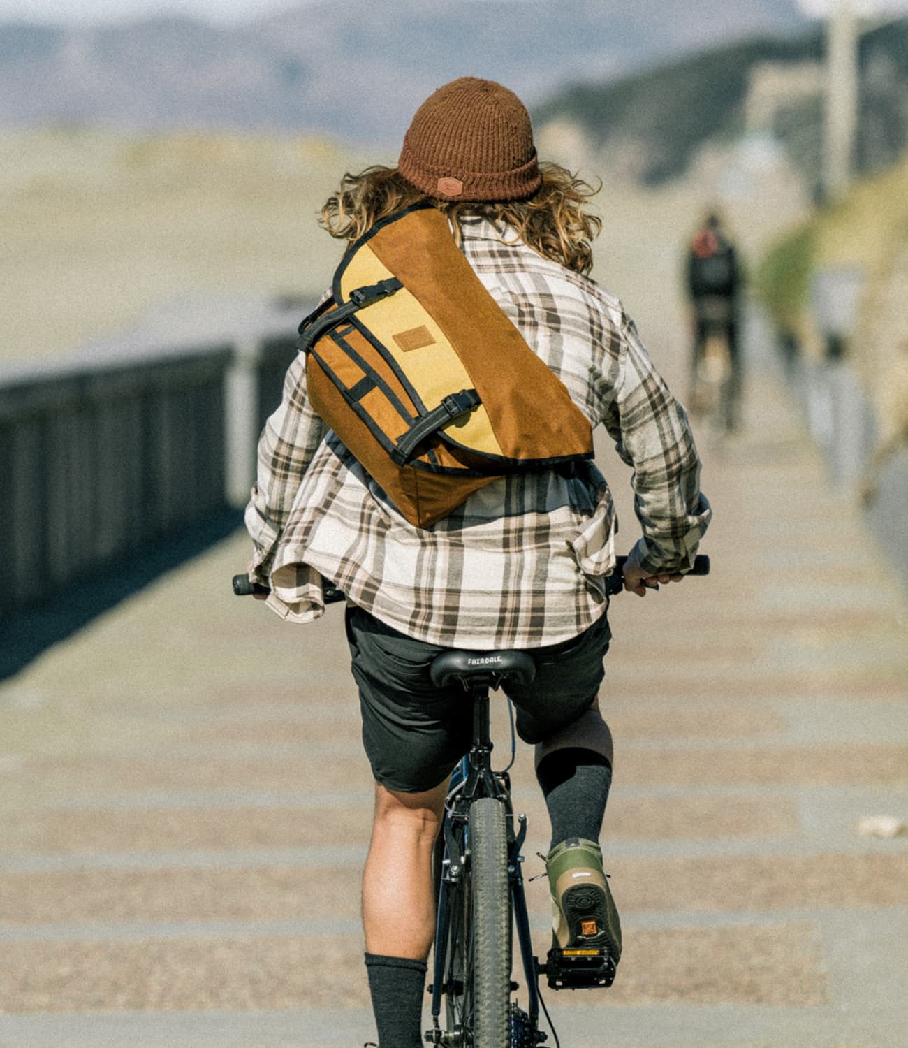 Citizen Messenger in Amber Tritone on a guy riding a bike mobile size image