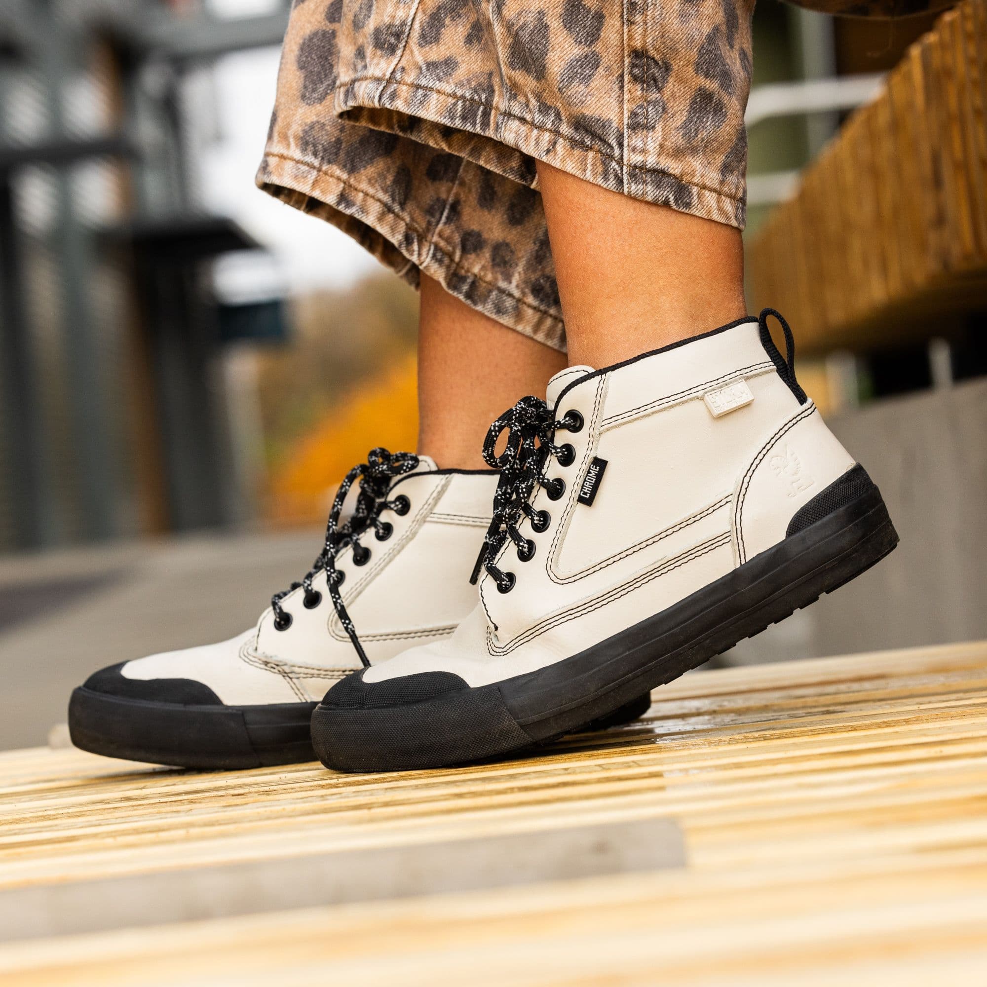 Waterproof Storm Boot in Bone Black worn by a woman #color_bone black