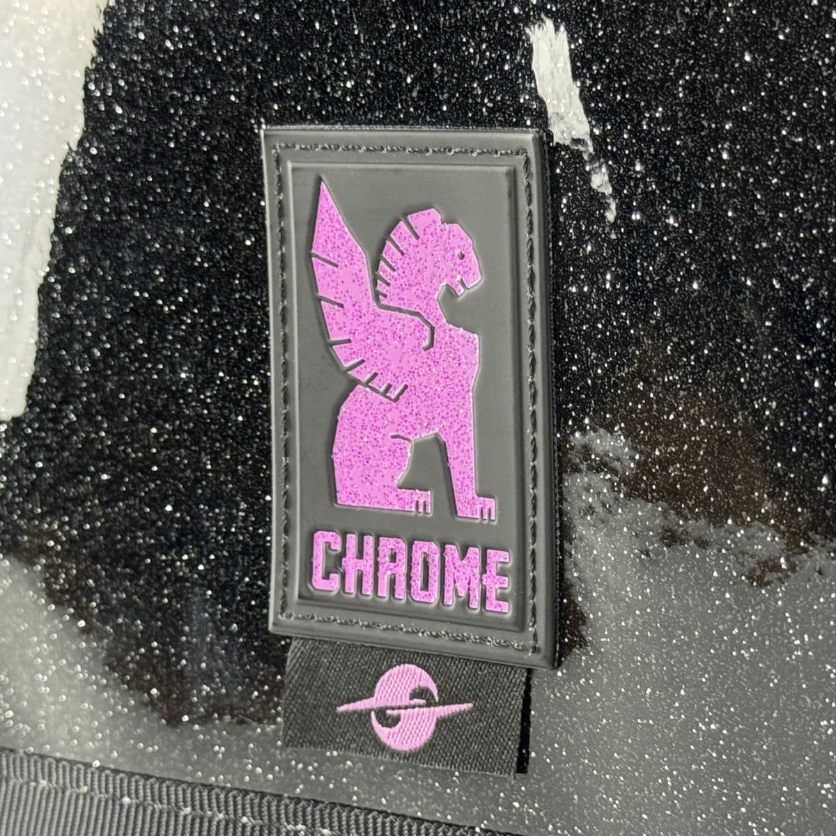 Glitter tag and panel up close on the Rio Rose Citizen #color_rio rose black