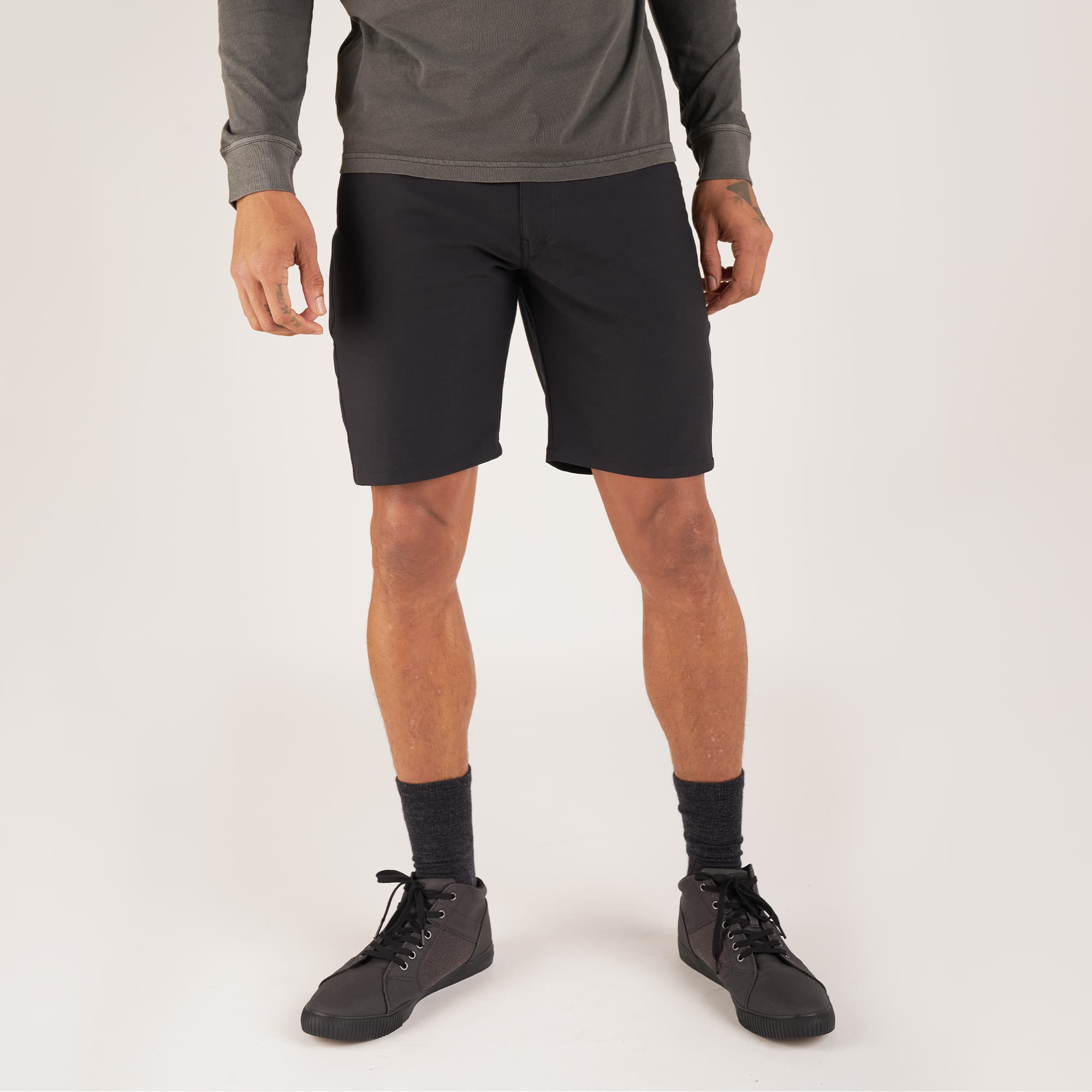 Men's Madrona 5-pocket short in black worn by a man #color_black