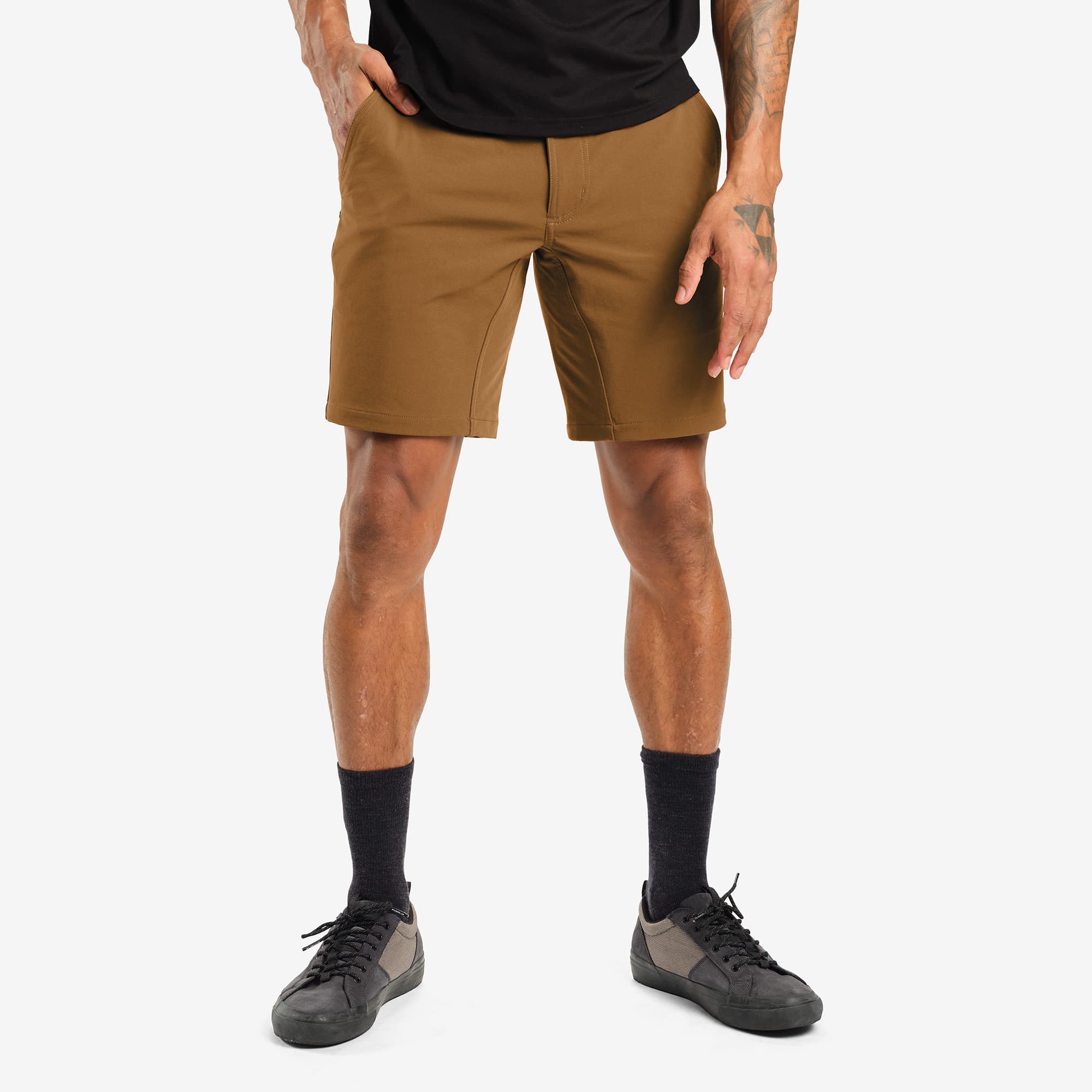 Men's tech Folsom Mid Short in brown worn by a man #color_monks robe