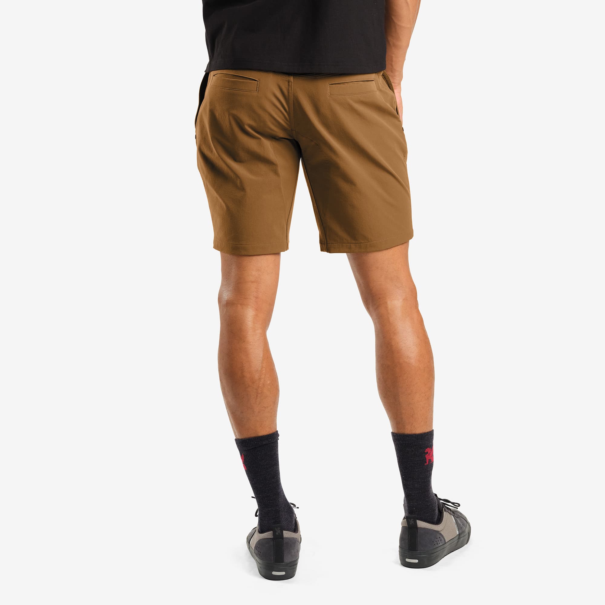 Men's tech Folsom Mid Short in brown worn by a man back detail #color_monks robe