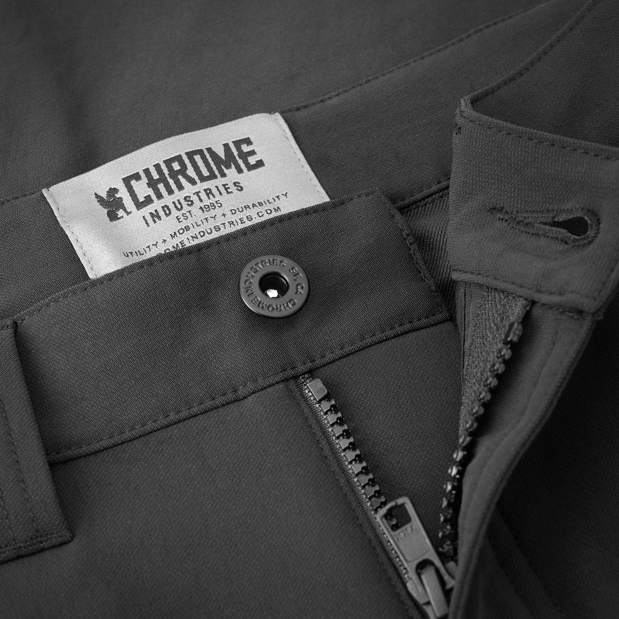 Women's Anza technical short in black zipper detail #color_black