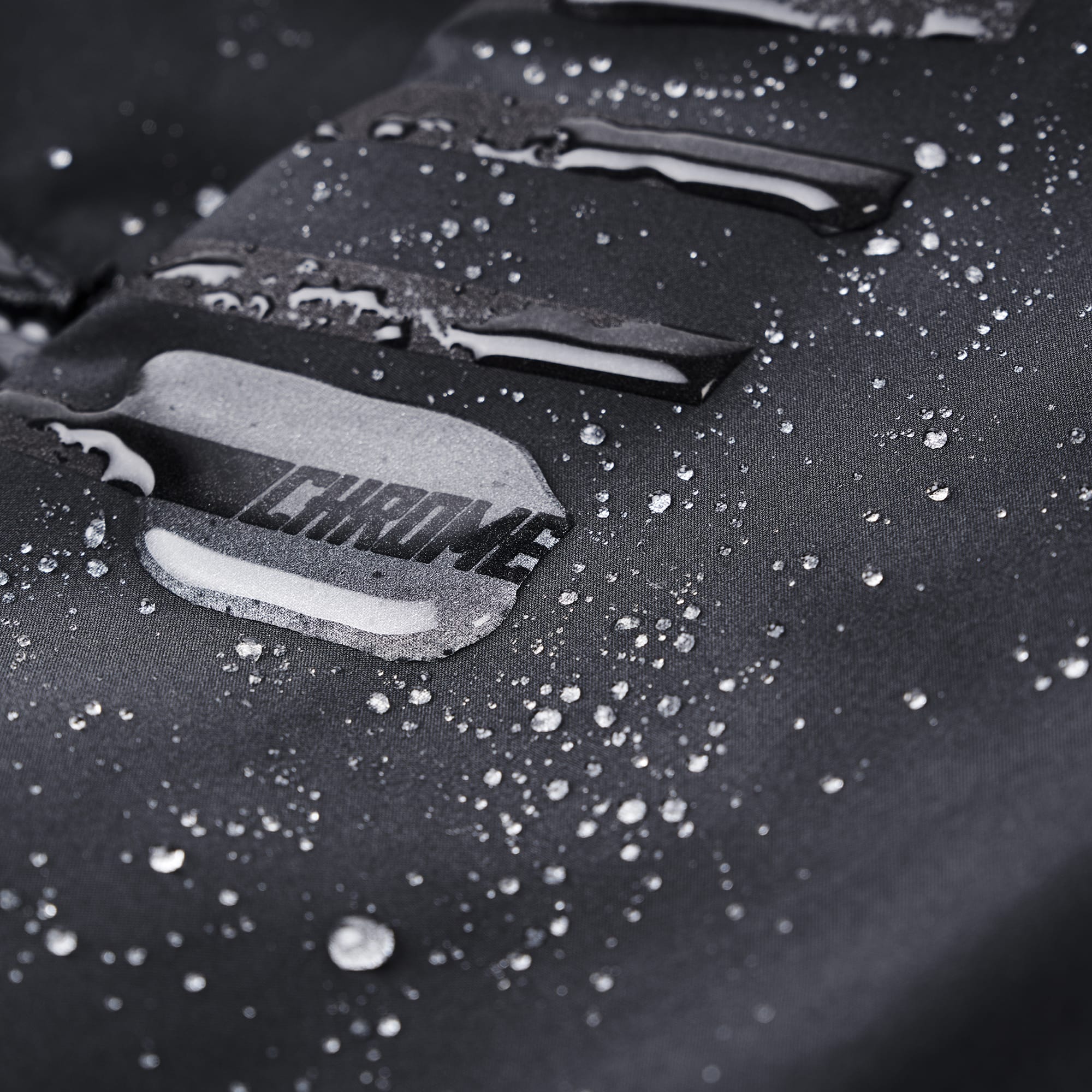 Waterproof rain pant in black water beading on the pant