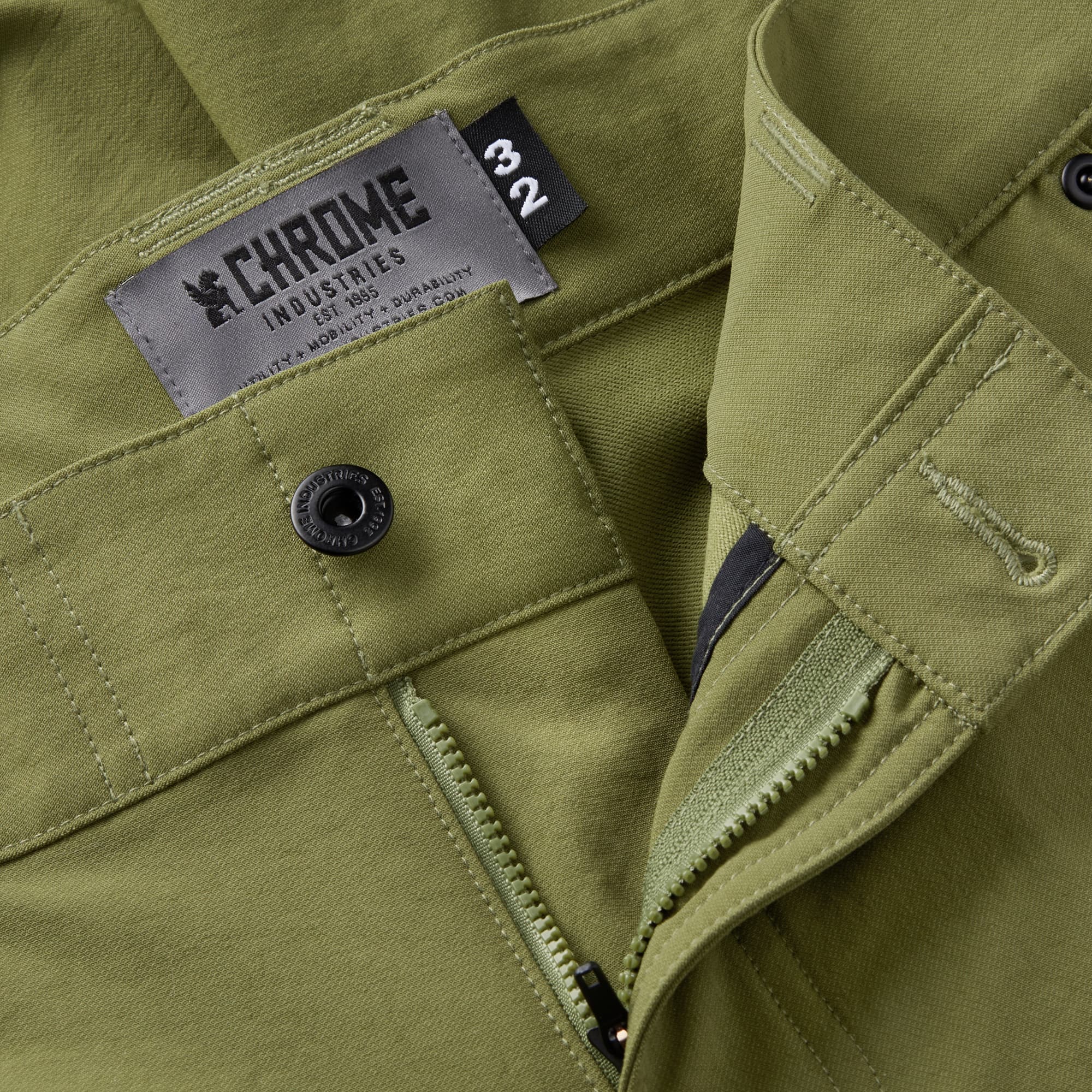 Men's Folsom tech biking Short in green button & zipper detail #color_olive branch