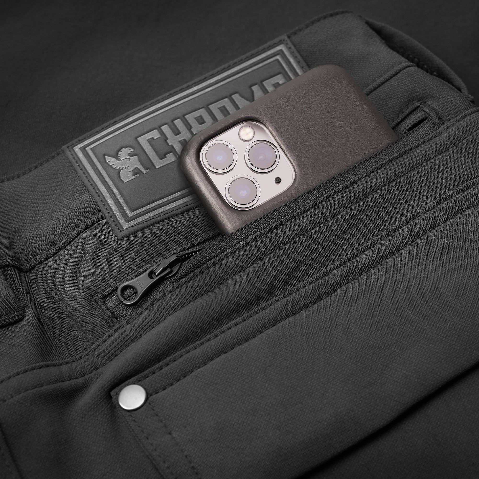 Women's Anza technical short in black pocket detail #color_black