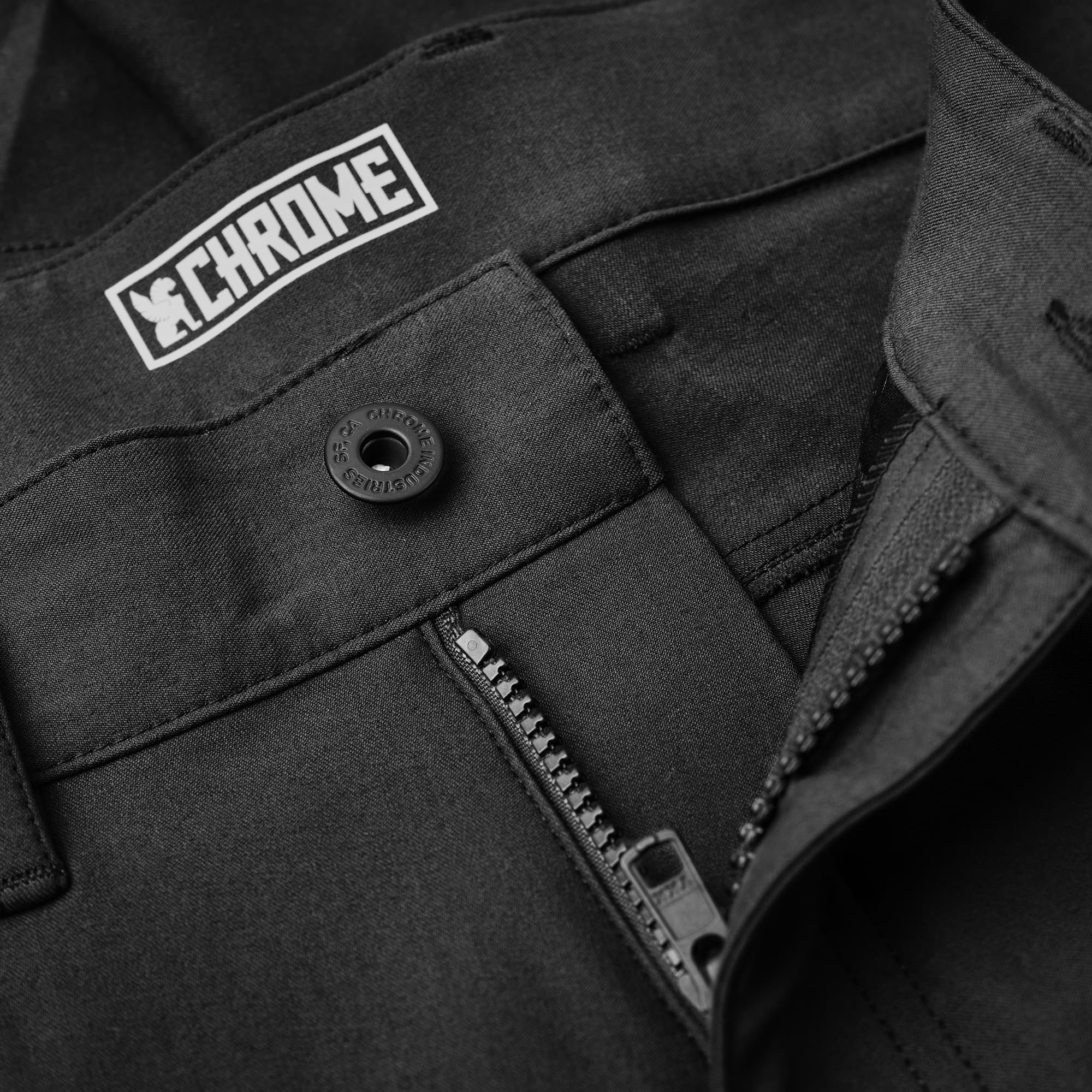 Men's Madrona tech 5-pocket short in black button & zipper detail #color_black