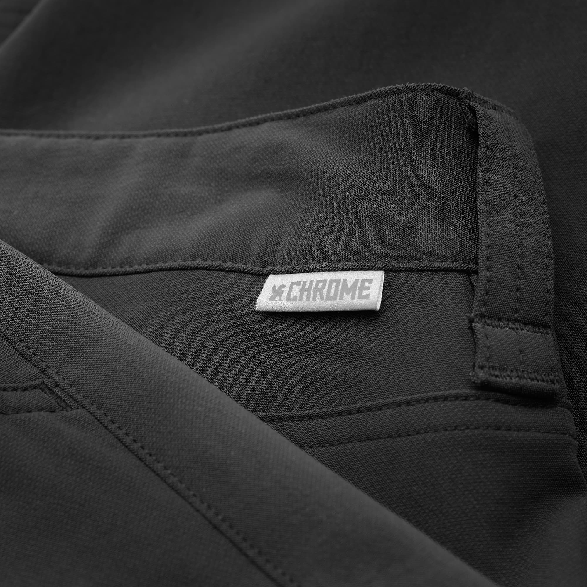 Men's Brannan tech Pant in black brand tag #color_black