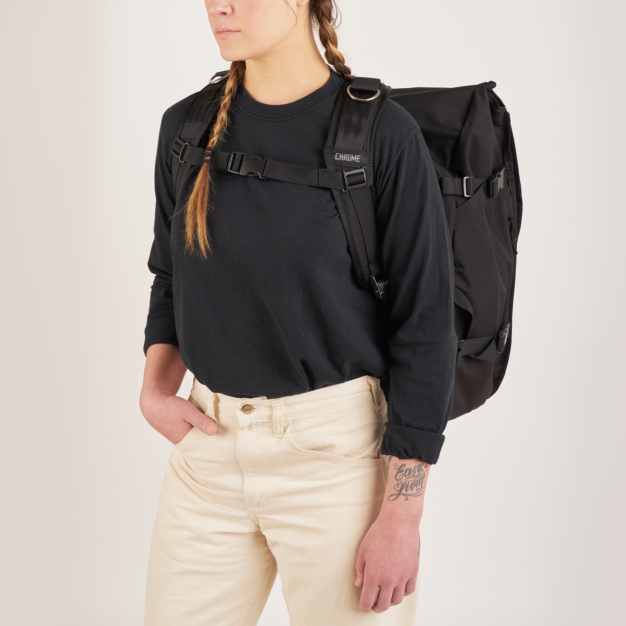 Warsaw Backpack in black front view on a woman #color_black