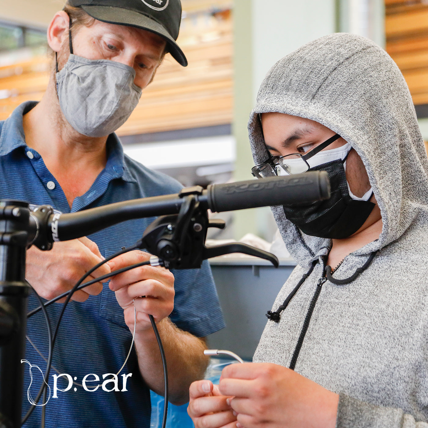 p:ear staff working on bikes