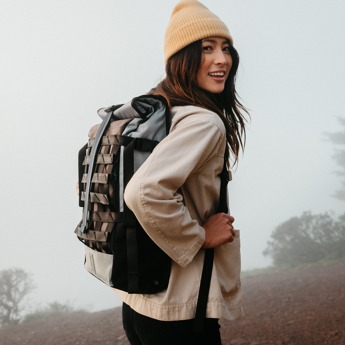 person wearing the Barrage Cargo Backpack in the Fog color