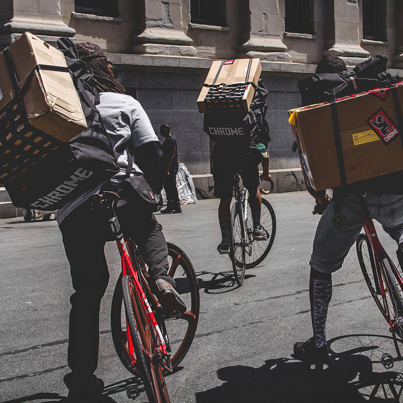 Pro delivery people carrying packages with the Barrage Pro bag