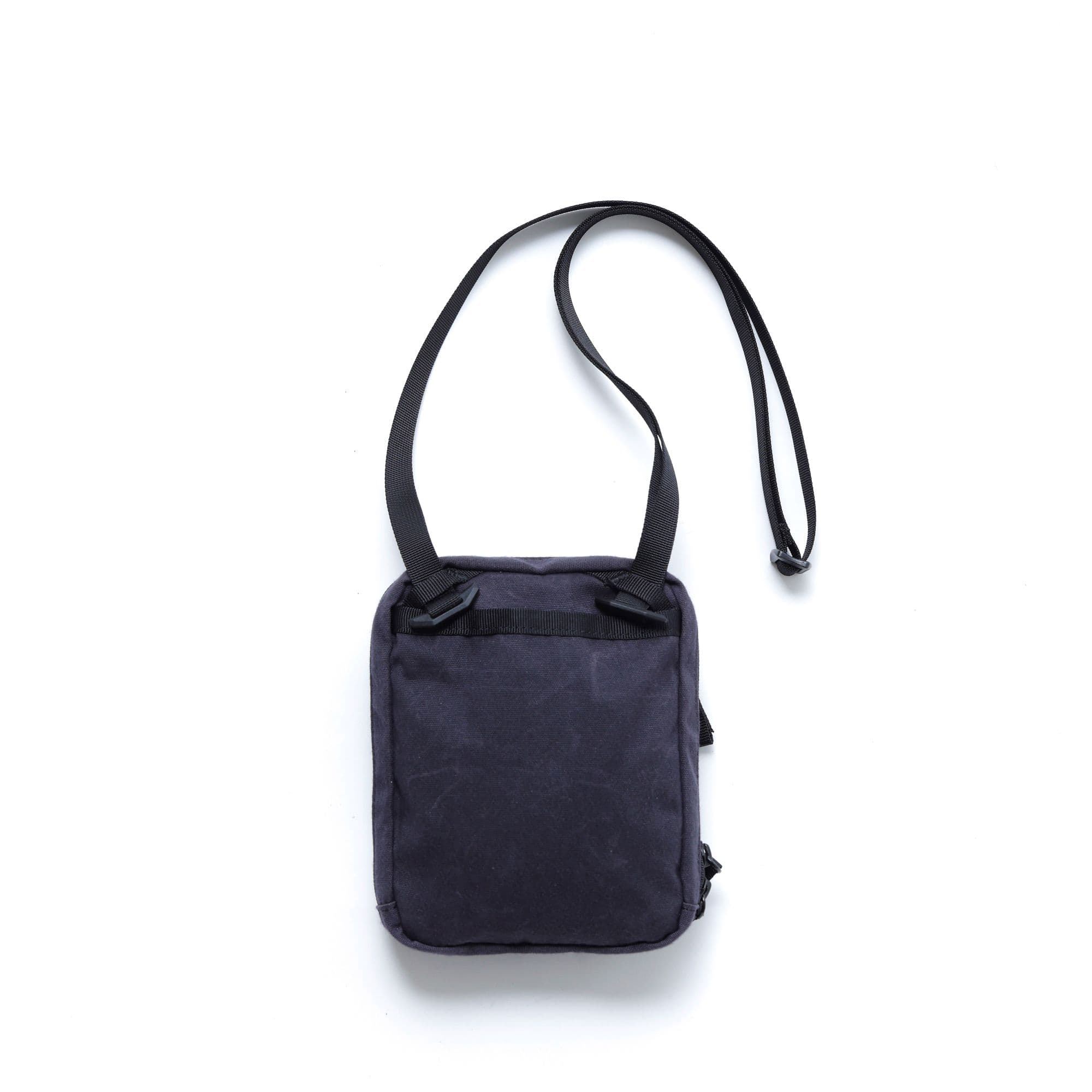 The back of the Pac Pouch 2L in Black Canvas Leather #color_black canvas leather