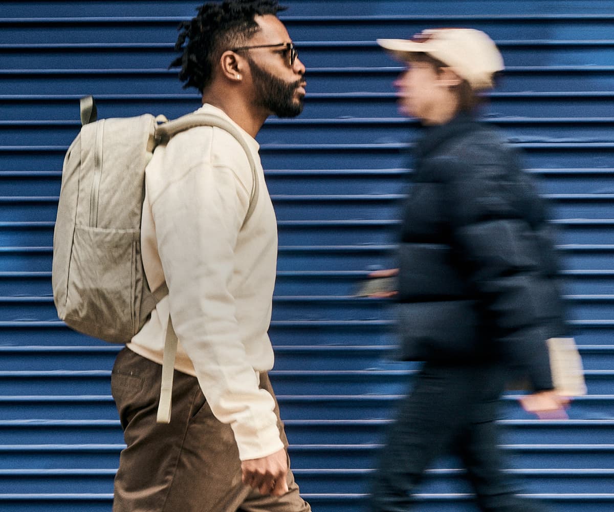 A man walking wearing a Highline pack